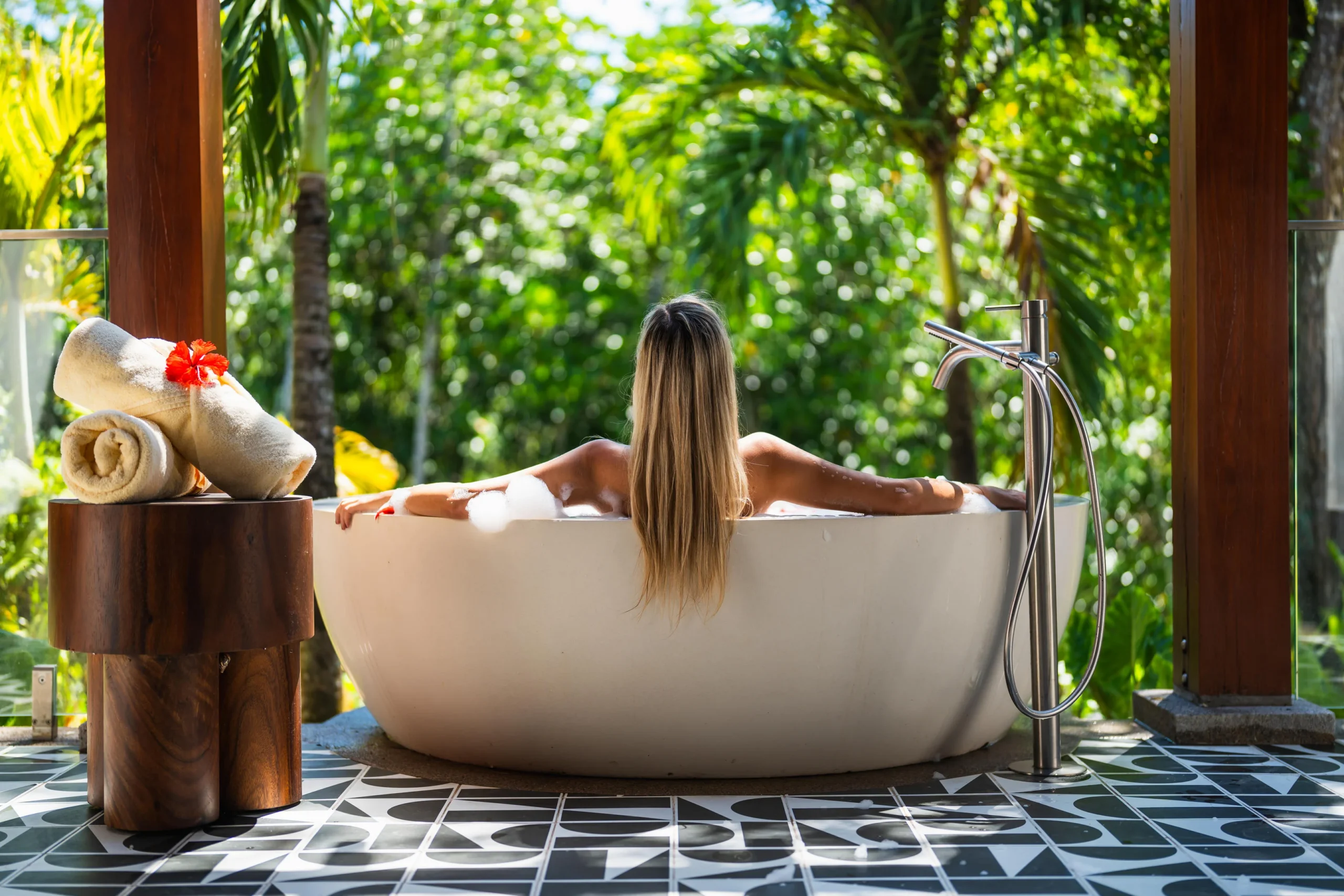 Bathtub in a guest suite at Canopy by Hilton Seychelles Resort in Mahé, Seychelles, designed for relaxation with contemporary island-inspired styling.