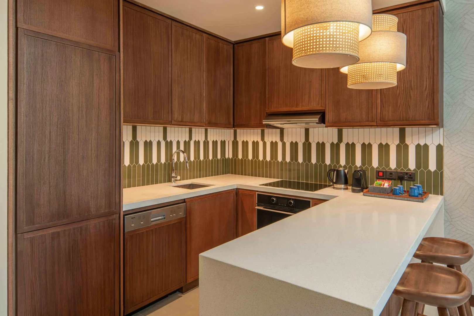 Kitchen in the King One Bedroom Apartment with Nature View at Canopy by Hilton Seychelles Resort in Mahé, Seychelles, featuring self-catering facilities and contemporary island-inspired design.