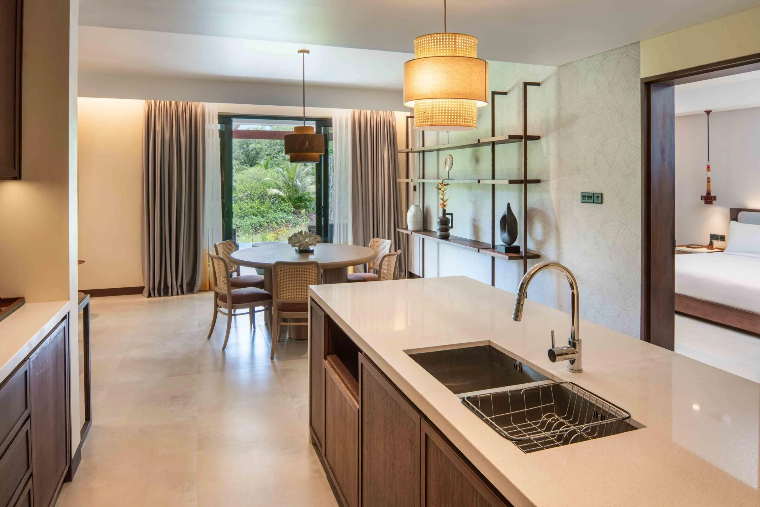 Kitchen sink area in the Two Bedroom Apartment with Nature View at Canopy by Hilton Seychelles Resort in Mahé, Seychelles, featuring contemporary finishes within the apartment's kitchen space.