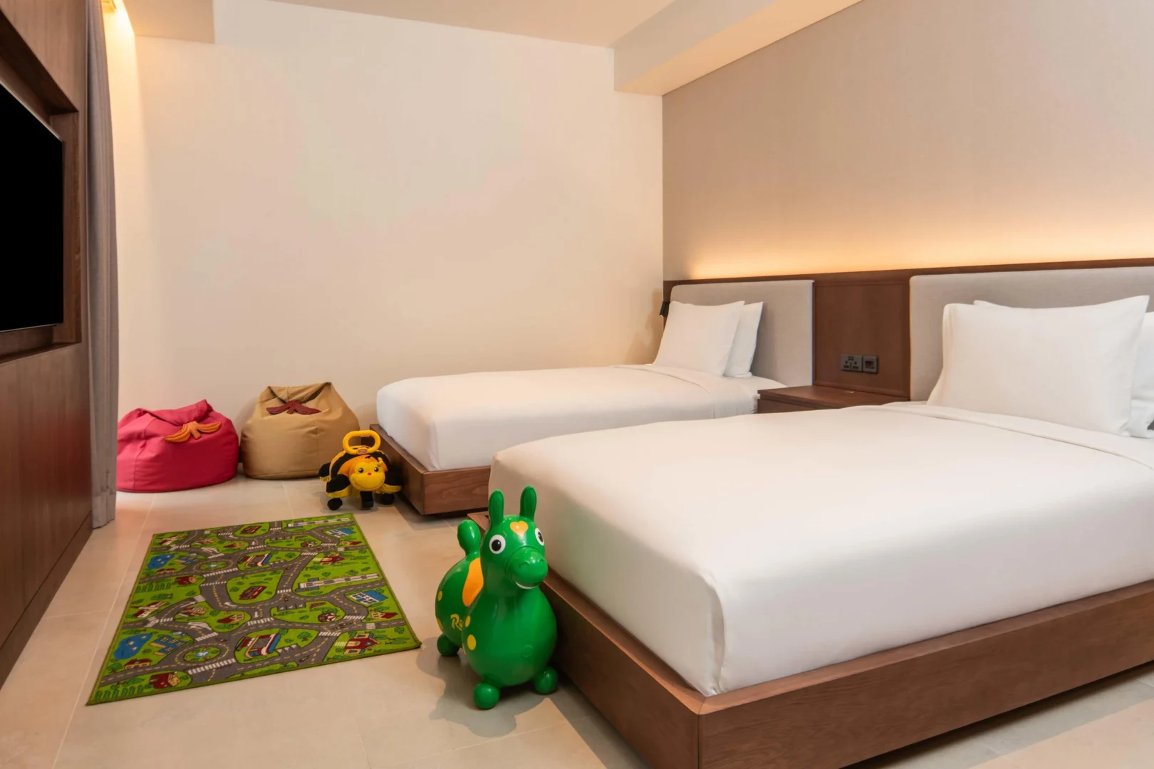 Twin bedroom in the Two Bedroom Apartment with Nature View at Canopy by Hilton Seychelles Resort in Mahé, Seychelles, featuring twin beds and contemporary island-inspired décor.