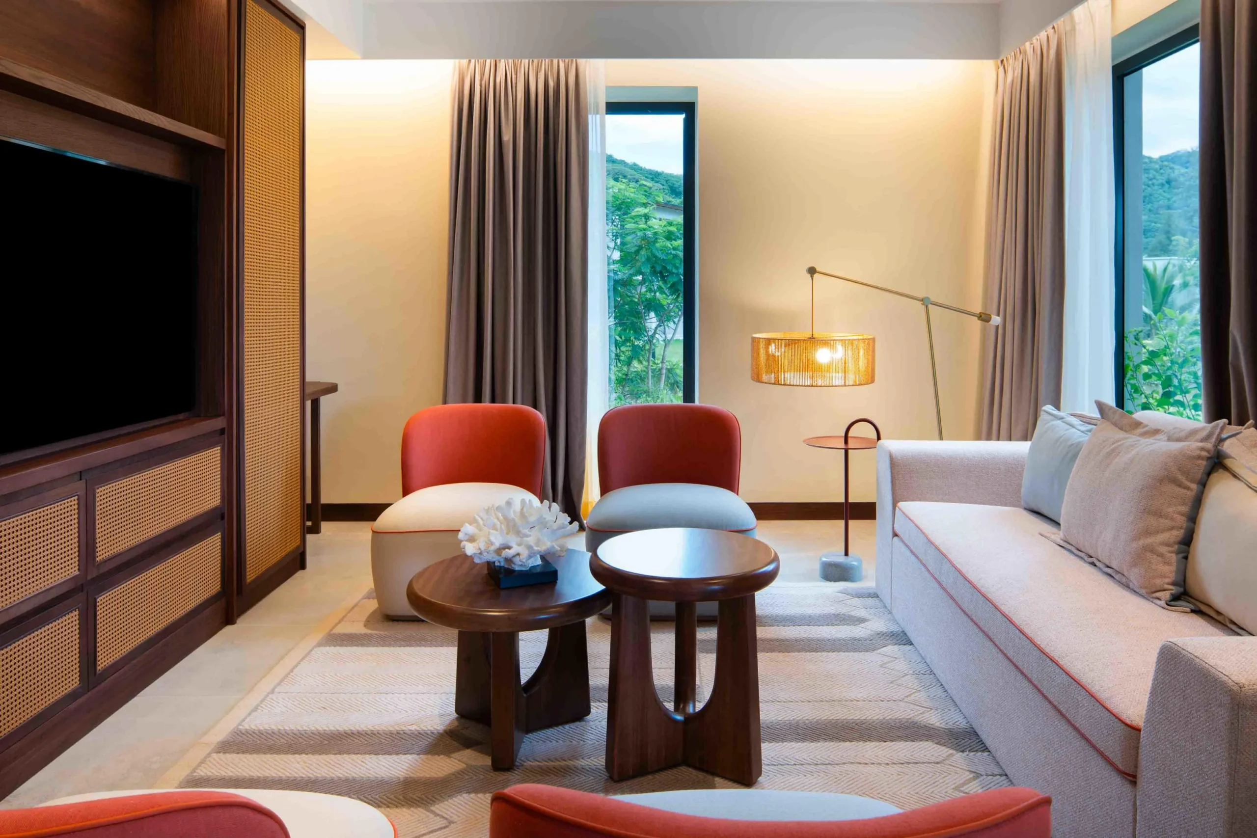 Living area in the Two Bedroom Apartment with Nature View at Canopy by Hilton Seychelles Resort in Mahé, Seychelles, featuring spacious lounge space and contemporary island-inspired design.