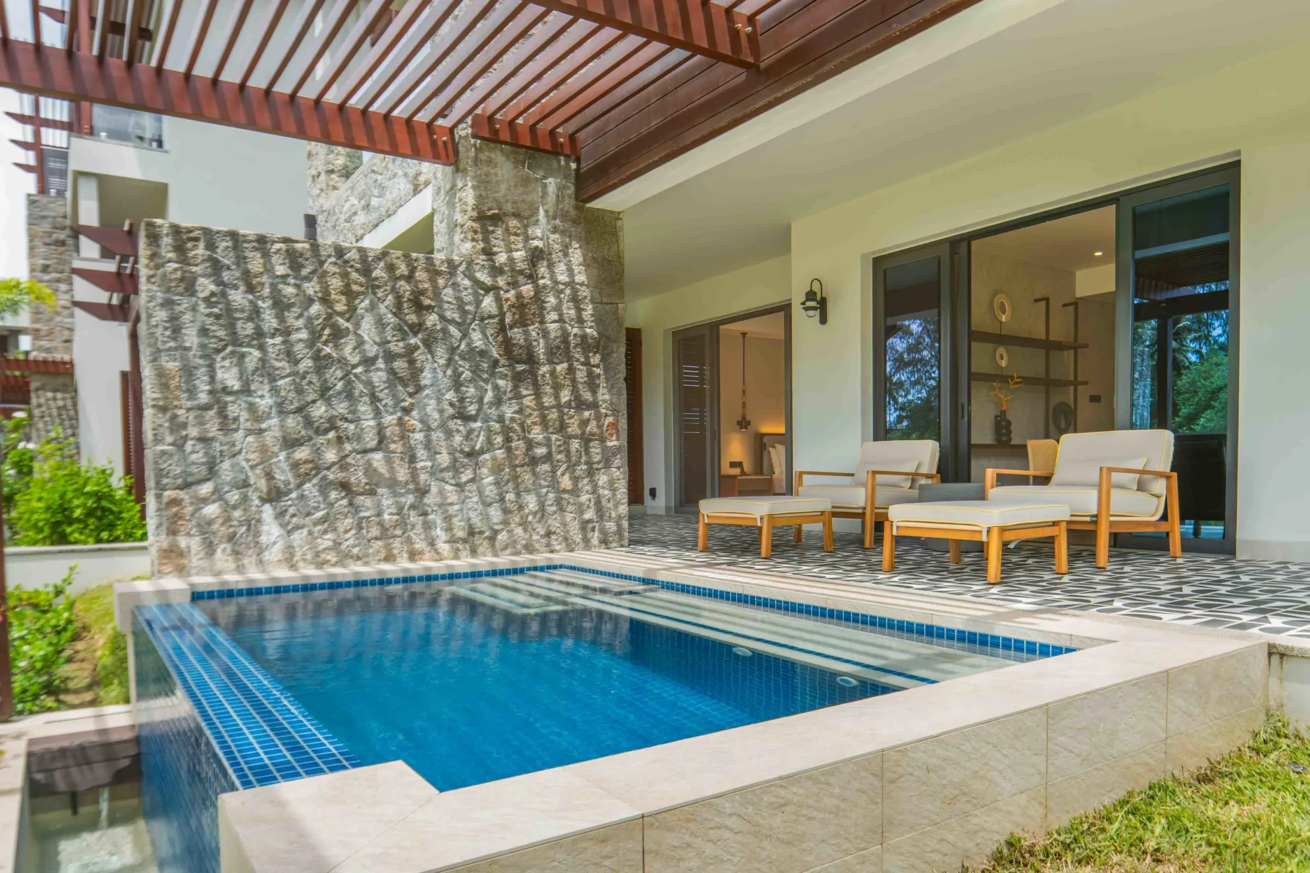 Exterior of the Two Bedroom Apartment with Private Pool at Canopy by Hilton Seychelles Resort in Mahé, Seychelles, featuring a private pool, outdoor terrace and apartment-style accommodation.