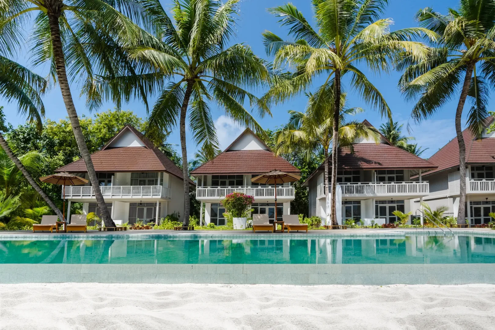 exterior view of a beach pavilion at sun siyam olhuveli maldives located steps from the beach