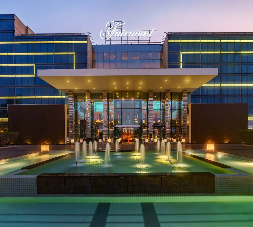 Exterior entrance of Fairmont Bab Al Bahr Abu Dhabi featuring contemporary architecture and a waterfront luxury resort setting
