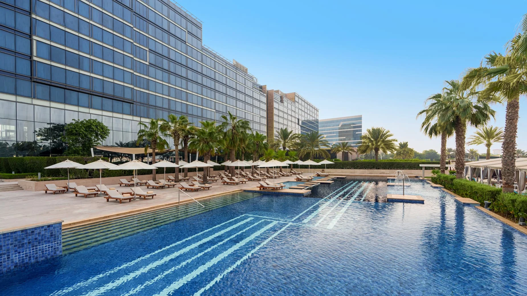 Poolside Bar at Fairmont Bab Al Bahr Abu Dhabi serving refreshing drinks and light bites beside the Olympic-length swimming pool
