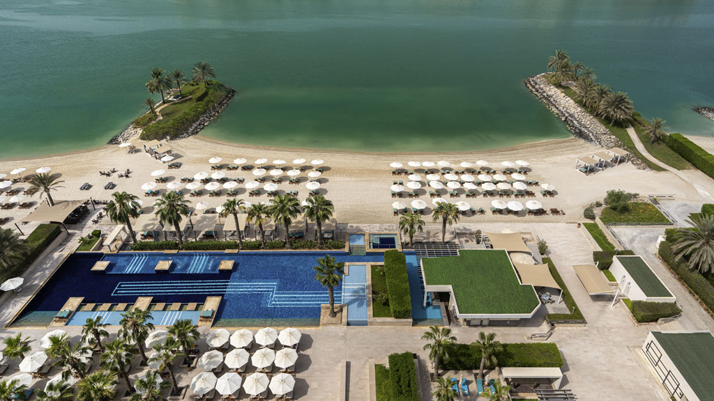 Private beach at Fairmont Bab Al Bahr Abu Dhabi overlooking Abu Dhabi Creek with views of the Sheikh Zayed Grand Mosque