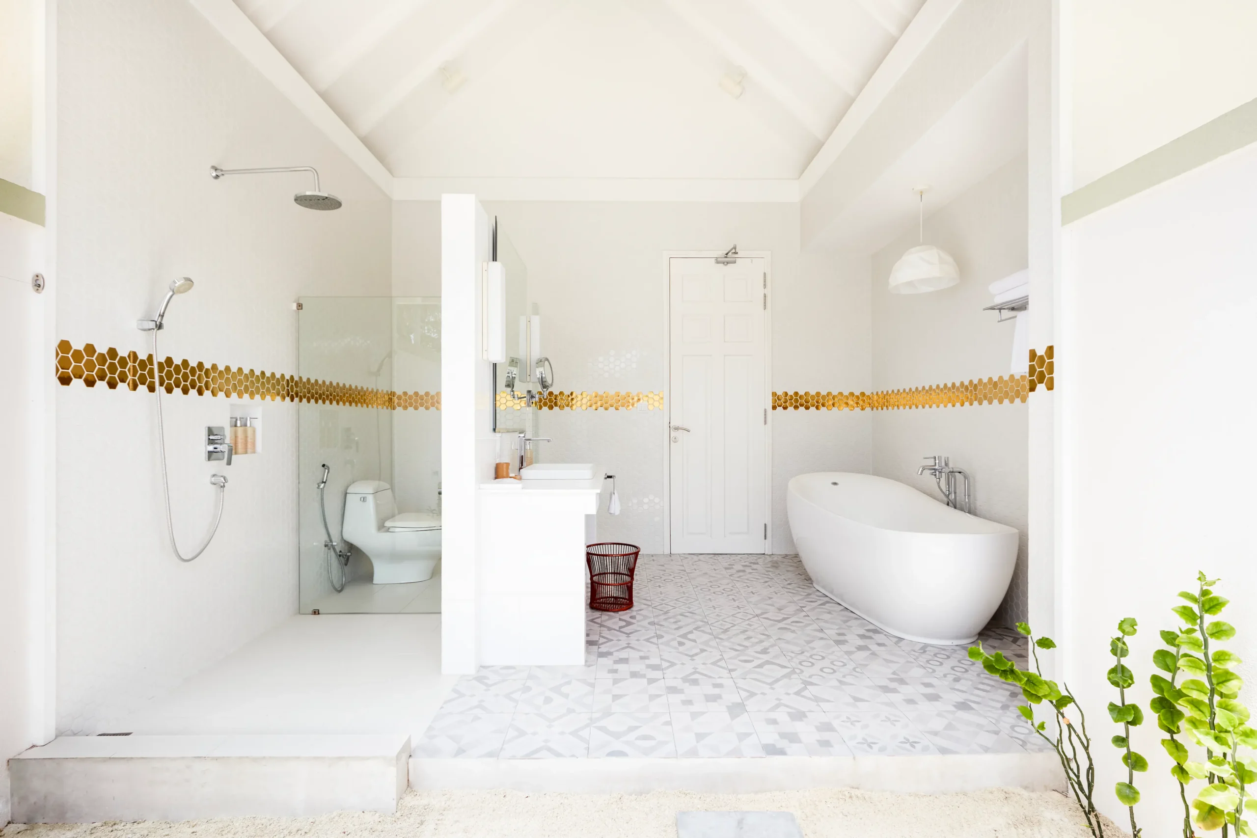 walk in shower in a grand beach villa at sun siyam olhuveli maldives featuring contemporary bathroom facilities