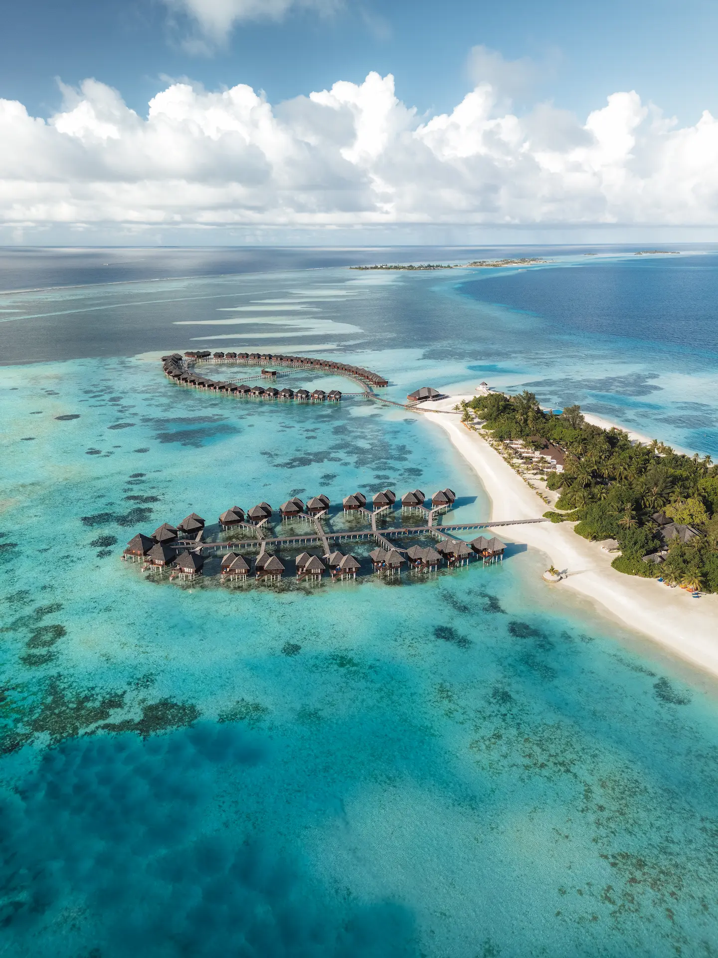 overwater villas at sun siyam olhuveli maldives positioned above the lagoon with direct access to the ocean