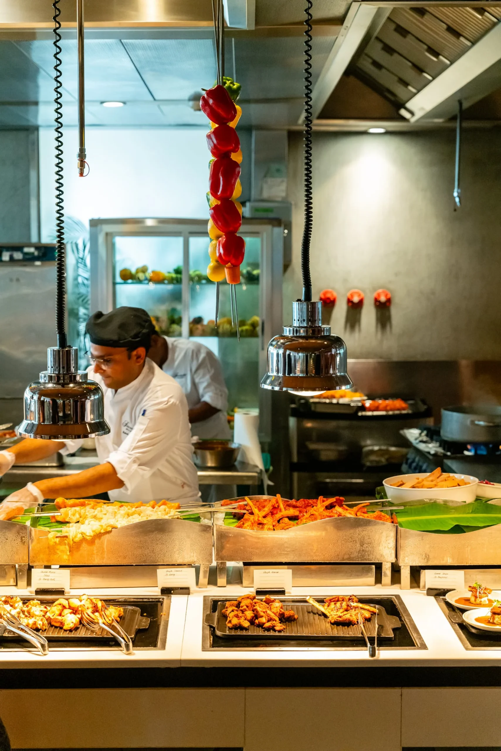 CuiScene restaurant at Fairmont Bab Al Bahr Abu Dhabi serving international dining with live cooking stations and waterfront views
