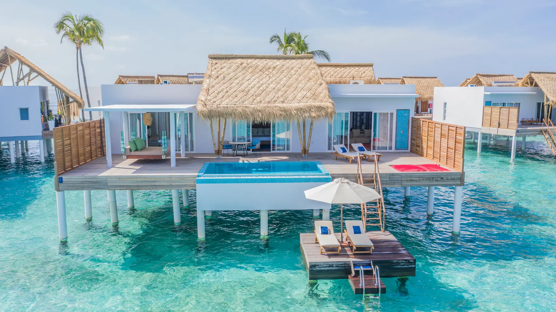 exterior of a superior water villa with pool at emerald maldives resort & spa in the maldives set above the lagoon with a private pool, expansive overwater terrace and direct ocean access
