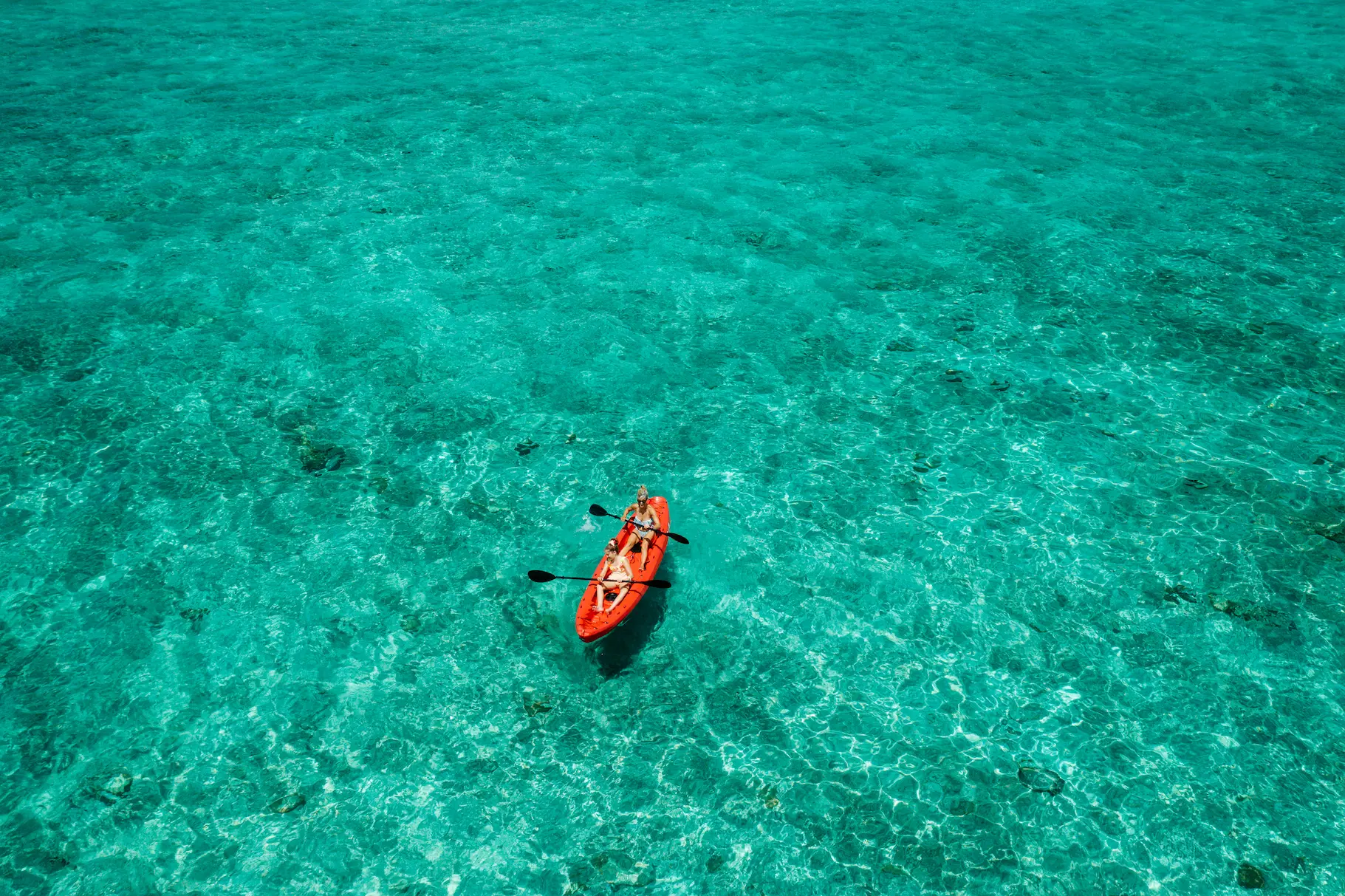 watersports at emerald maldives resort & spa in the maldives including kayaking, windsurfing and activities on the lagoon