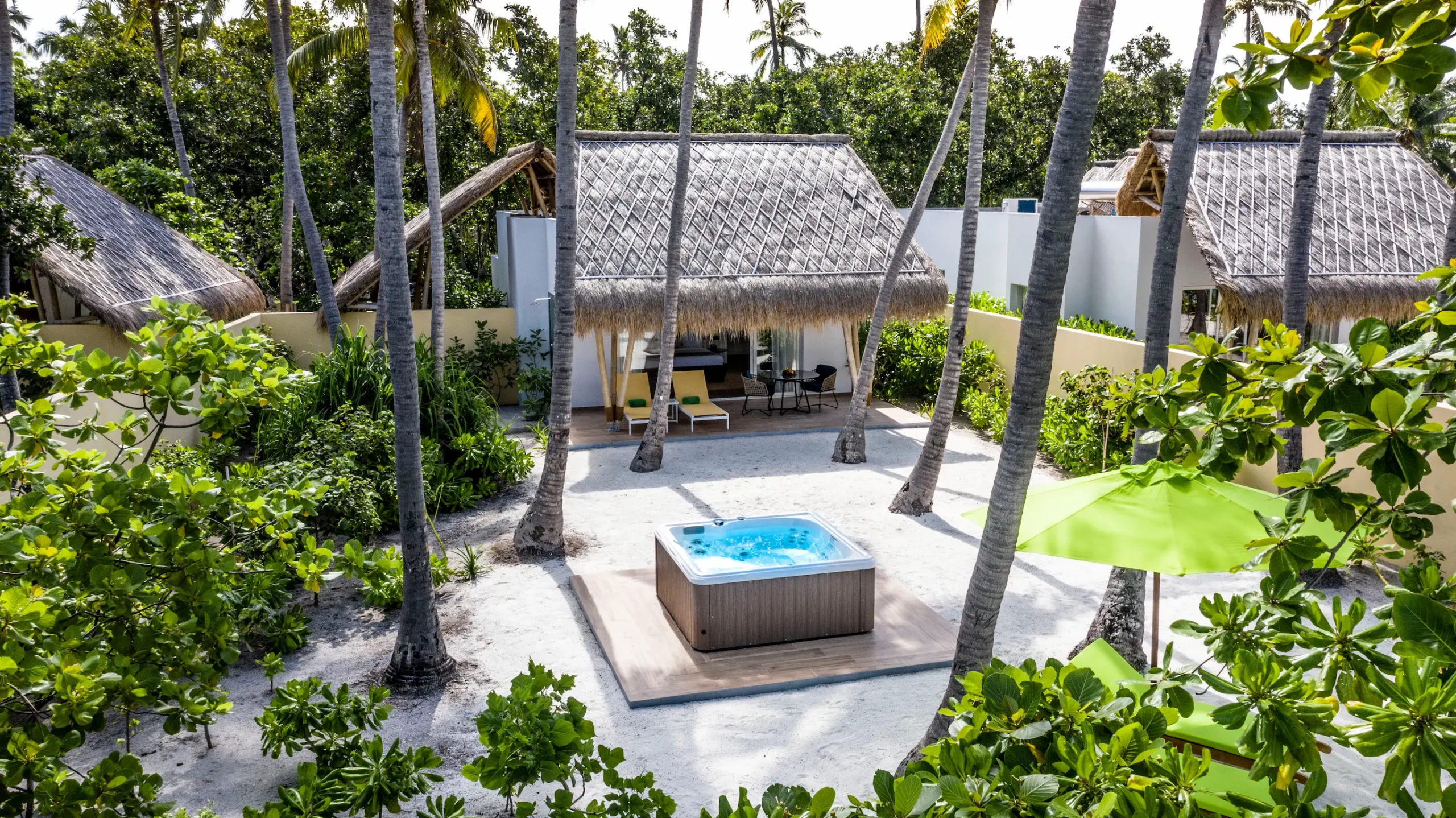 exterior of a jacuzzi beach villa at emerald maldives resort & spa in the maldives with direct beach access and private outdoor jacuzzi