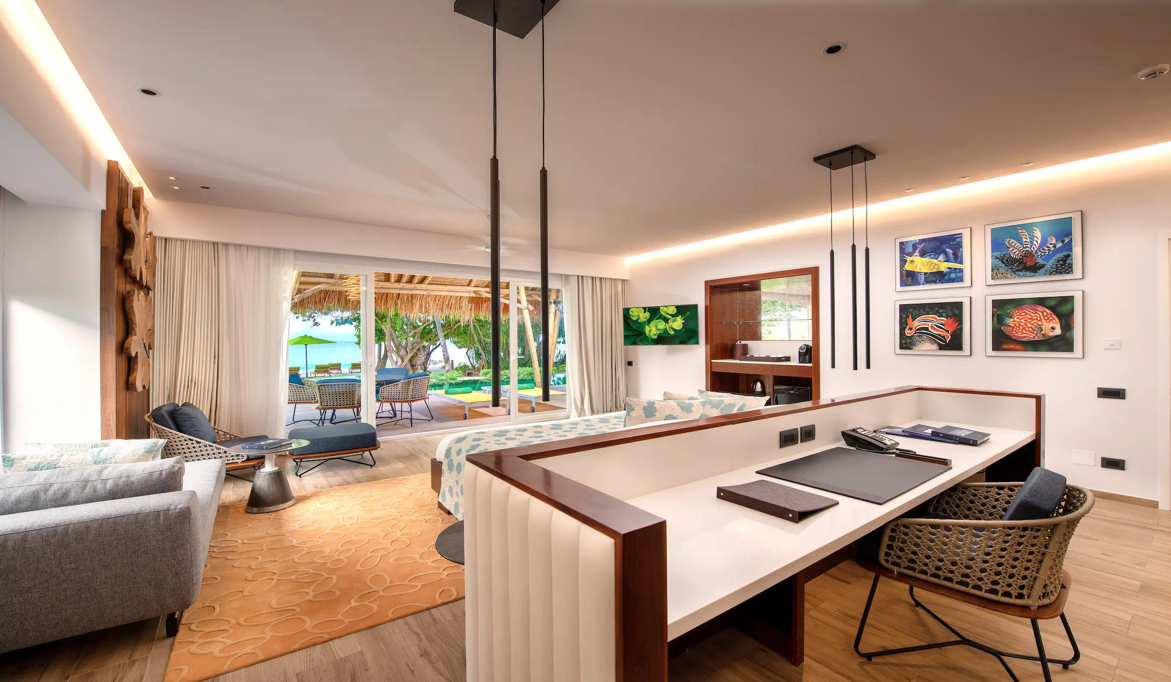 interiors of a family beach villa with pool at emerald maldives resort & spa in the maldives featuring spacious living areas, contemporary furnishings and family-friendly accommodation