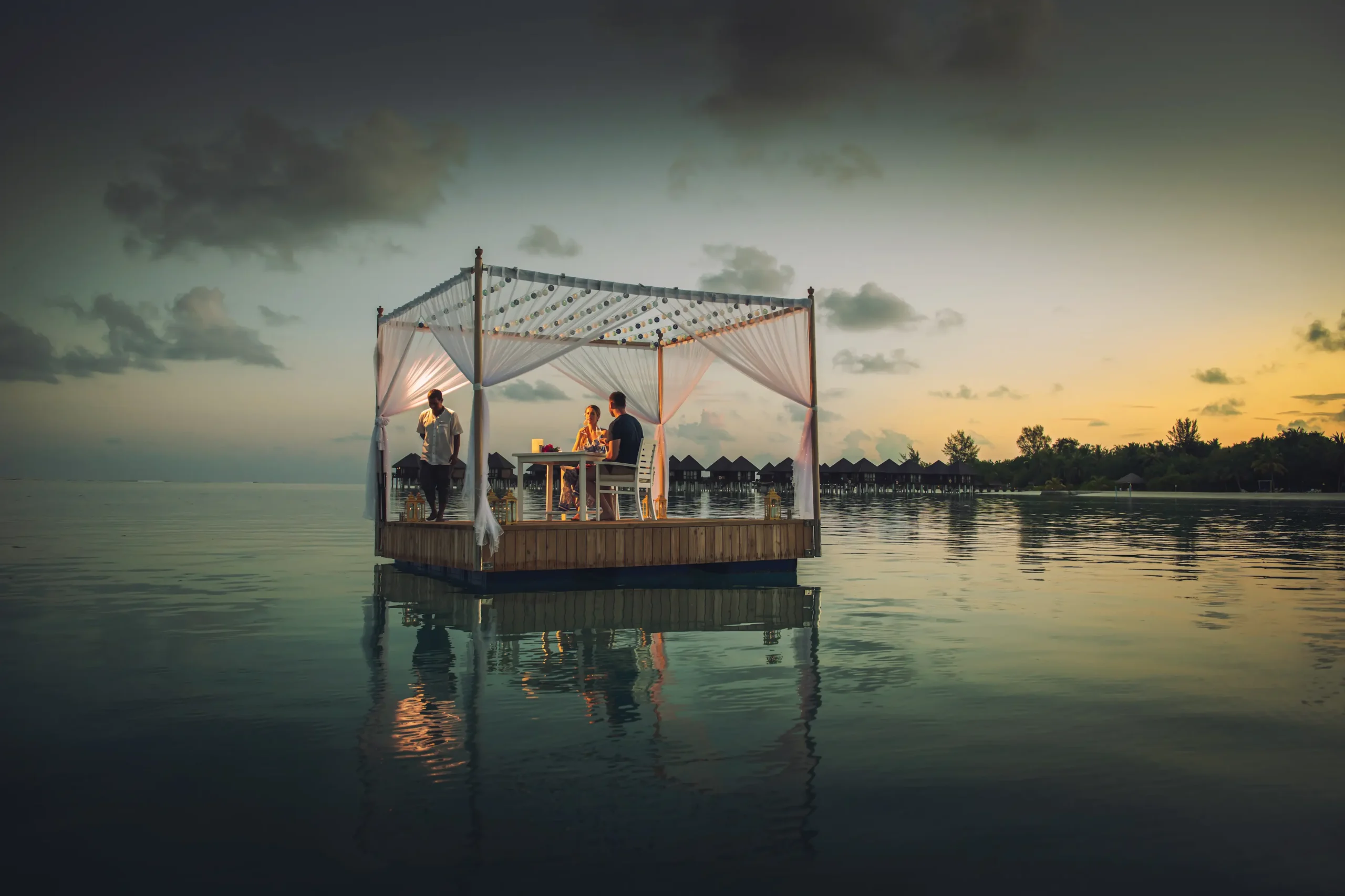 private destination dining experience on a floating platform at sun siyam olhuveli maldives
