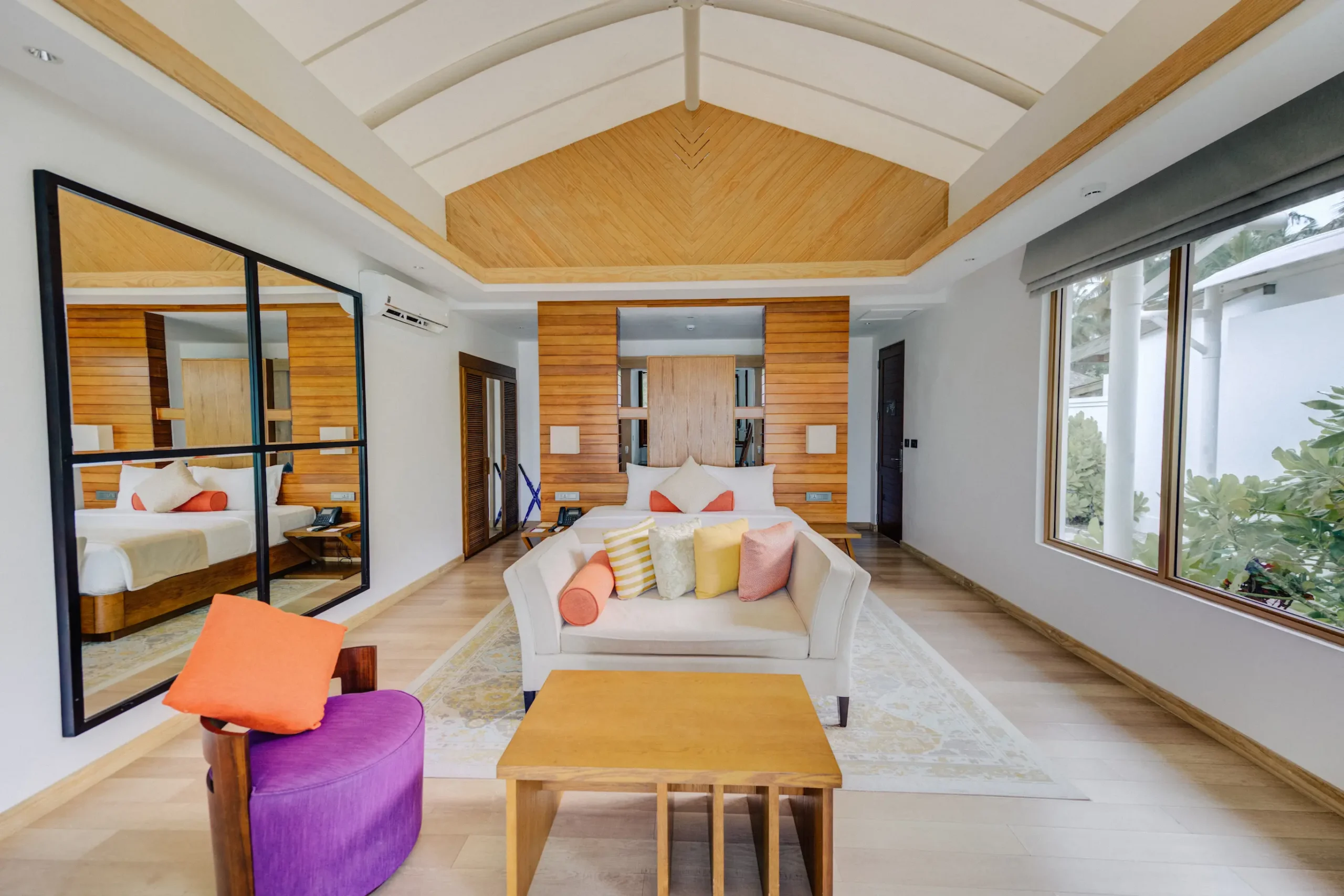 Bedroom interior of a Beach Bungalow at Cinnamon Hakuraa Huraa Maldives, Maldives.