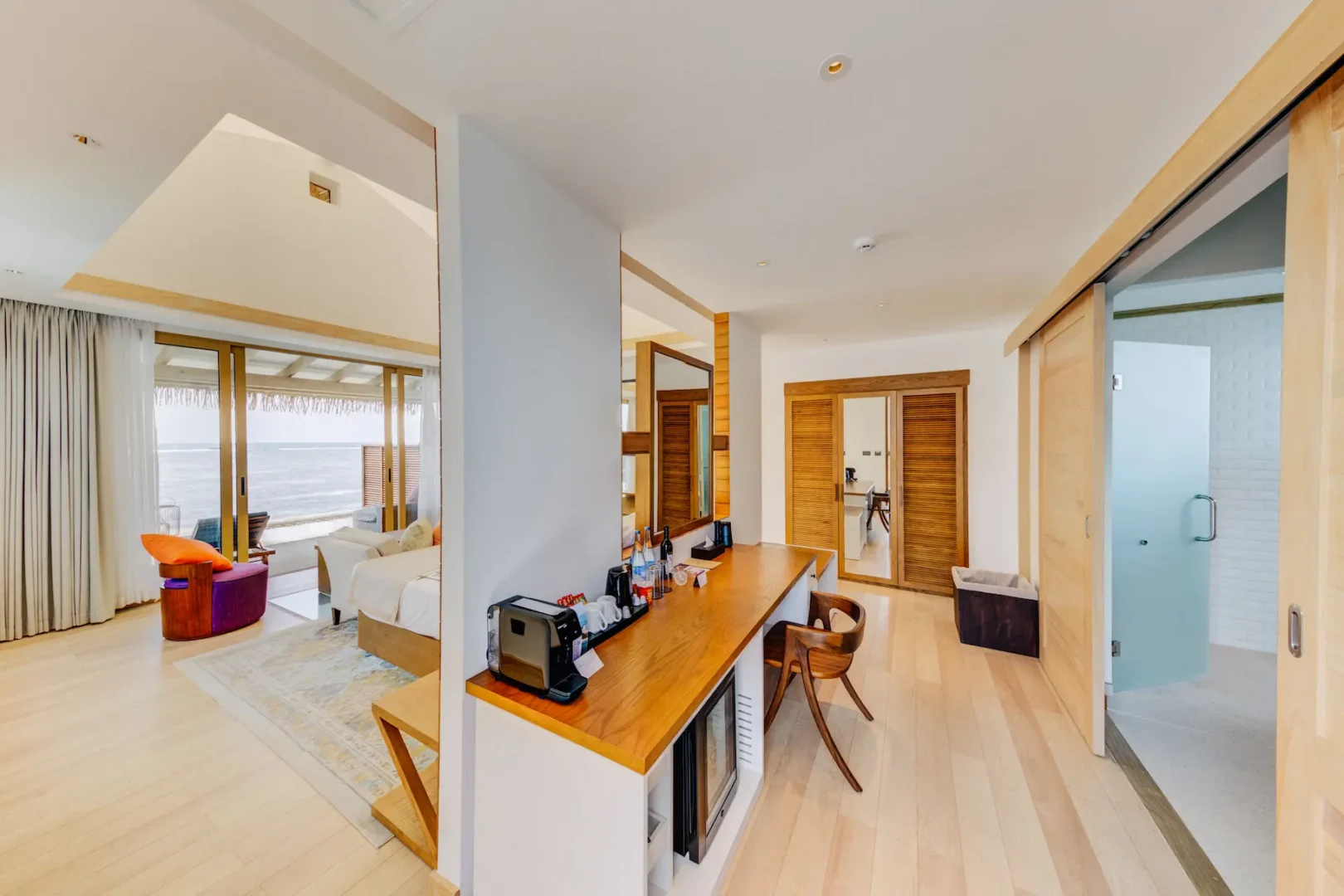 Interior overview of a Water Bungalow at Cinnamon Hakuraa Huraa Maldives, Maldives.