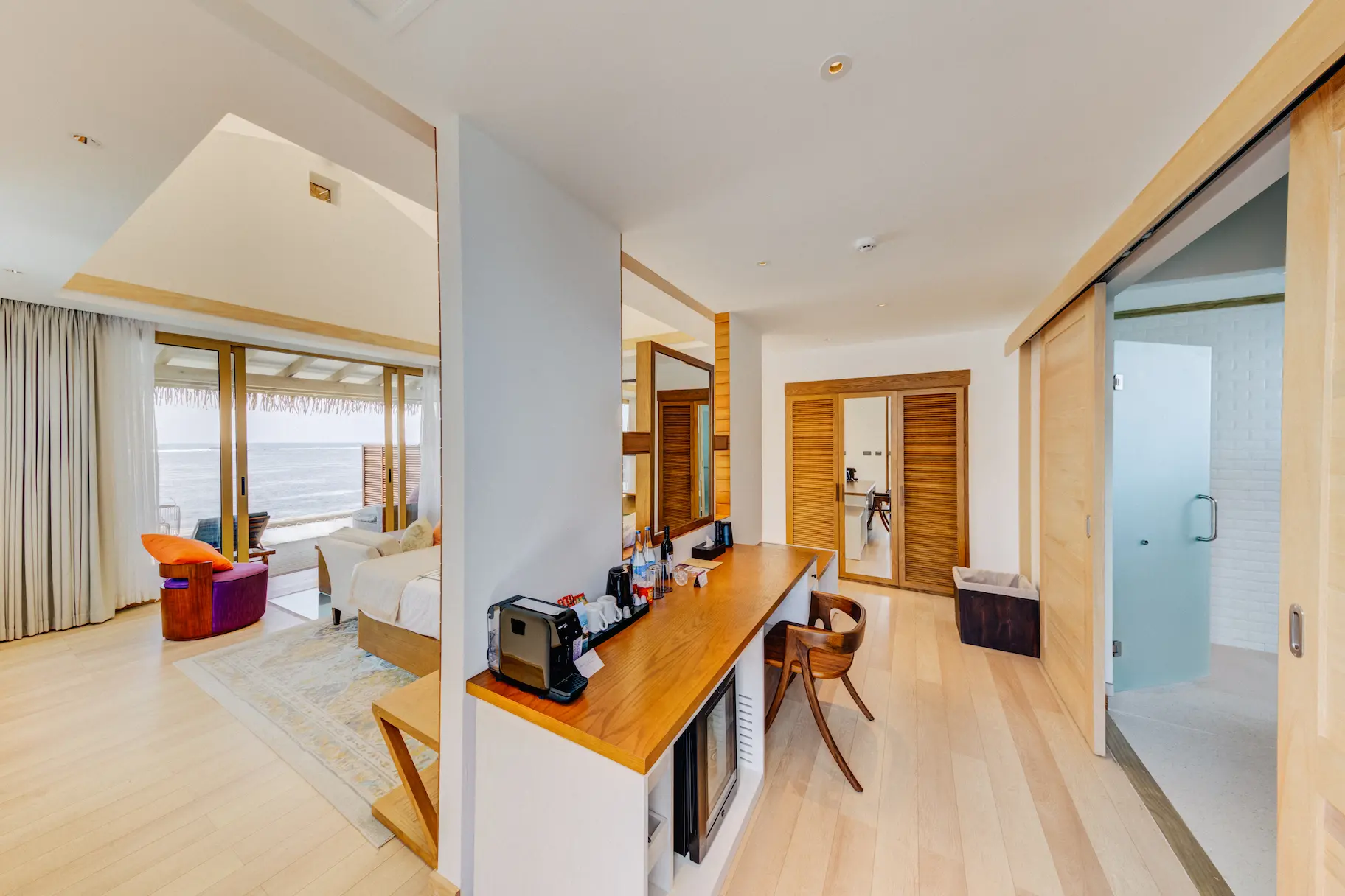 Interior overview of a Water Bungalow at Cinnamon Hakuraa Huraa Maldives, Maldives.