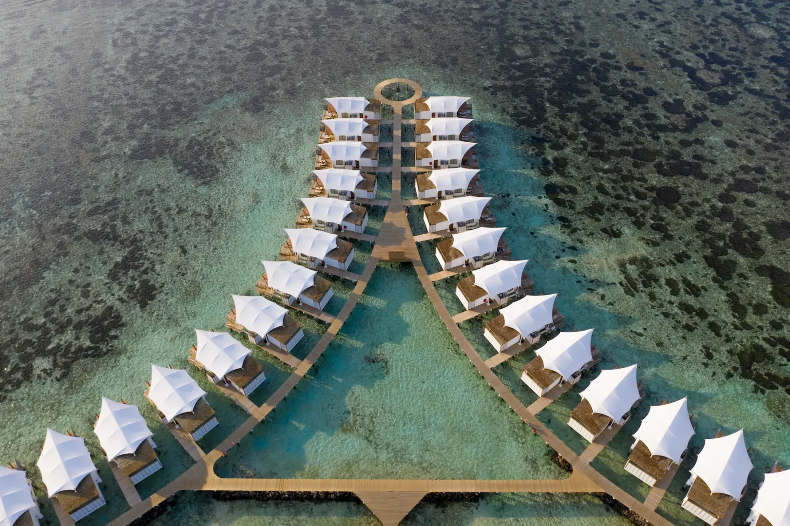 Aerial view of Water Bungalows at Cinnamon Hakuraa Huraa Maldives, Maldives.
