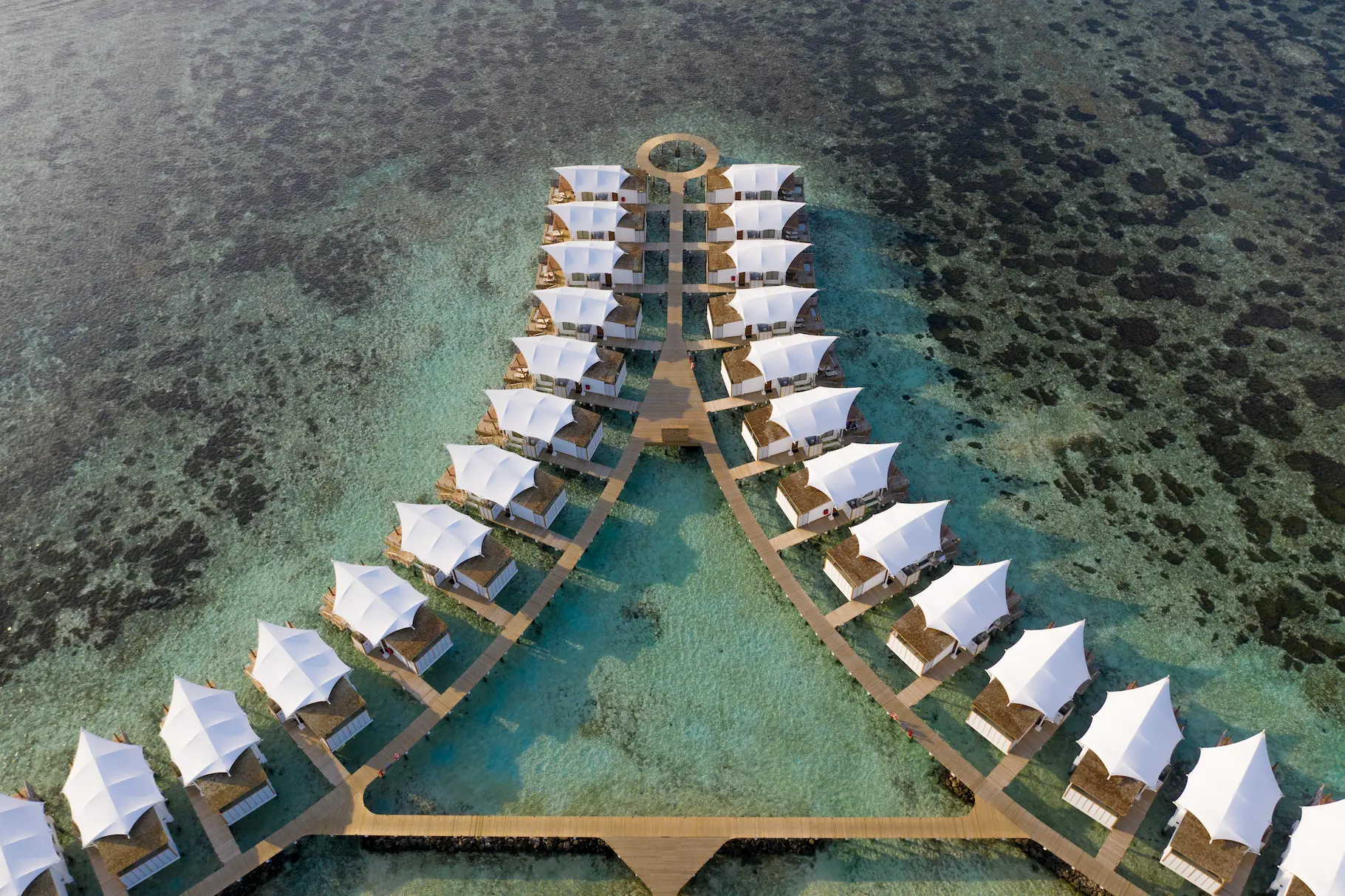 Aerial view of Water Bungalows at Cinnamon Hakuraa Huraa Maldives, Maldives.
