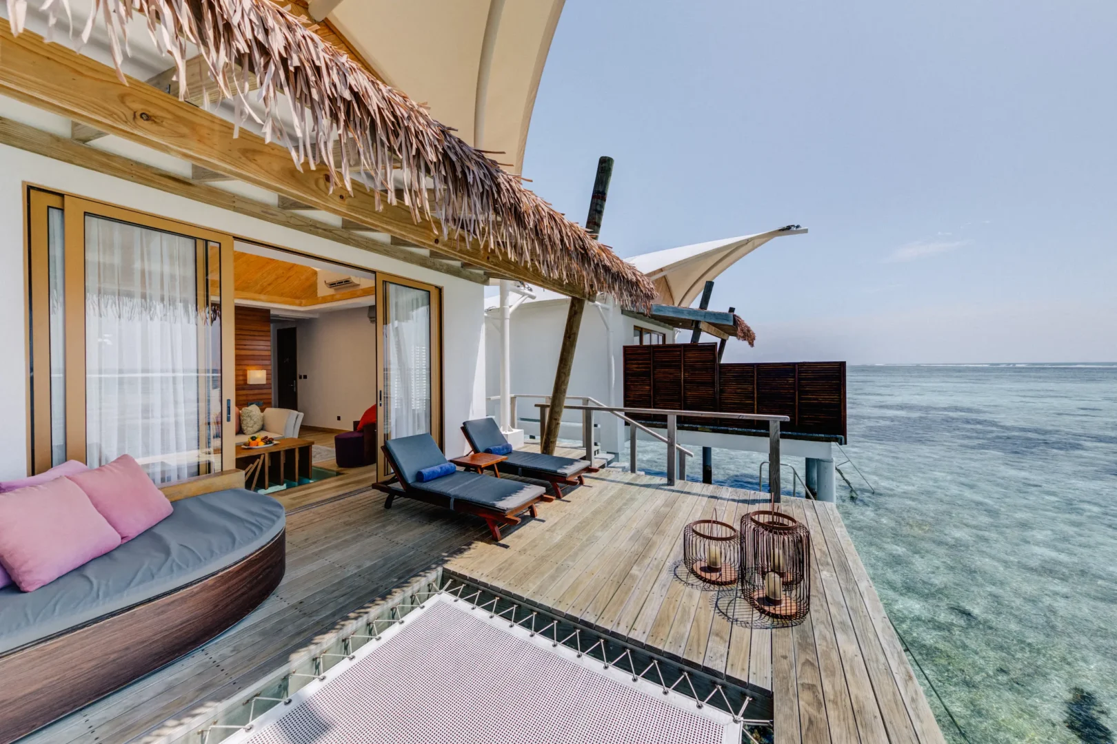 Private terrace of a Water Bungalow at Cinnamon Hakuraa Huraa Maldives, Maldives.
