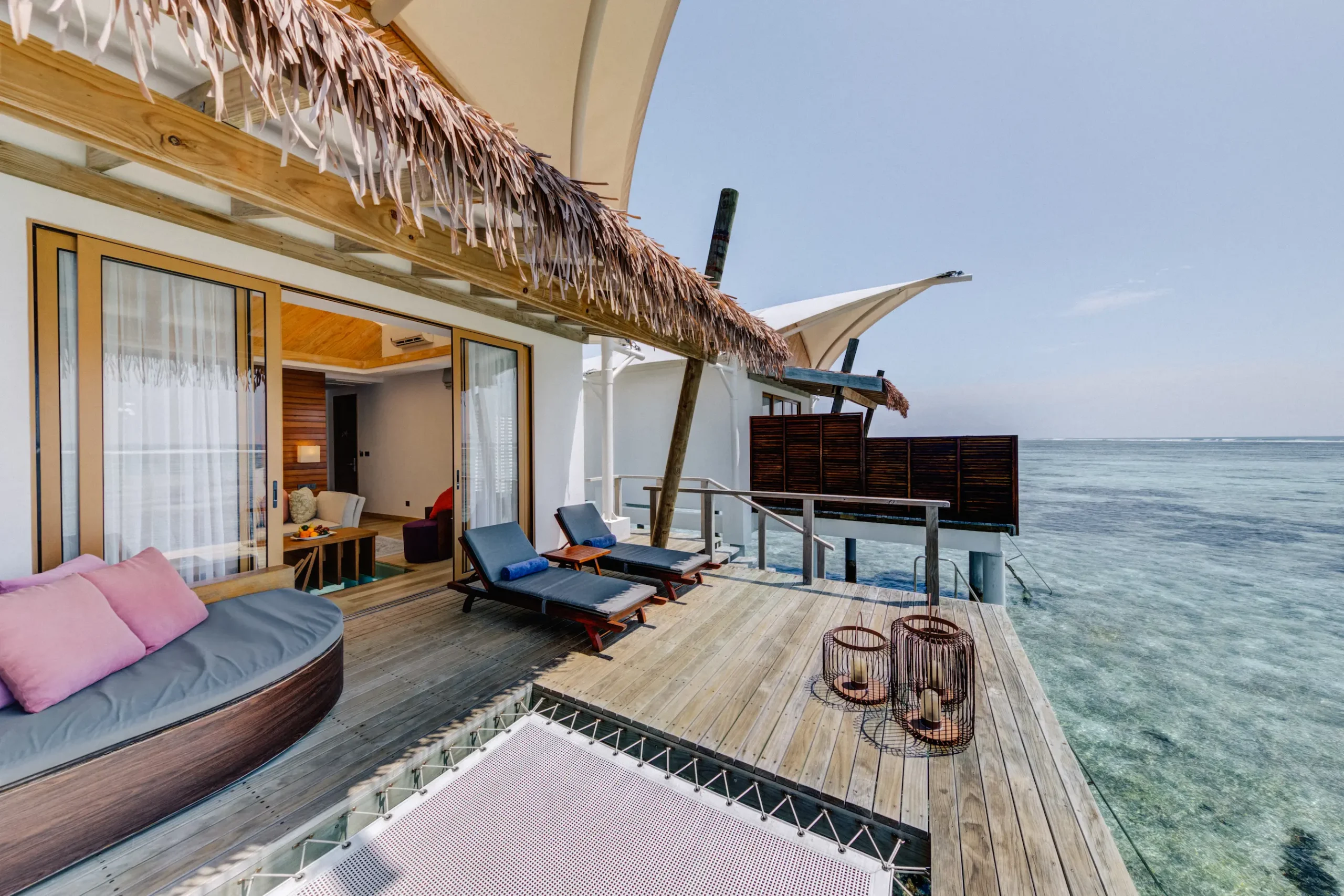 Private terrace of a Water Bungalow at Cinnamon Hakuraa Huraa Maldives, Maldives.