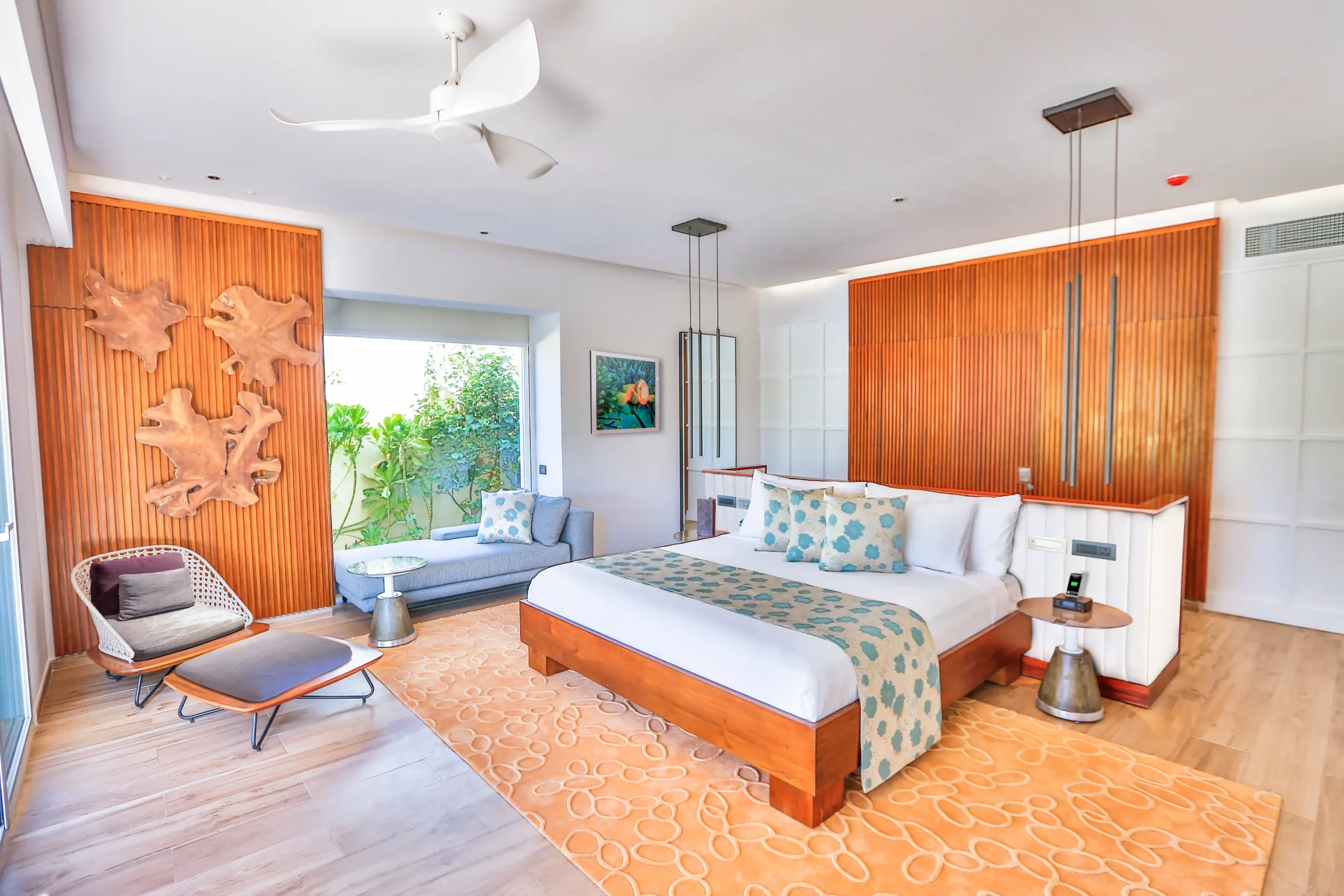 interior of a beach villa at emerald maldives resort & spa in the maldives featuring contemporary furnishings and spacious living space