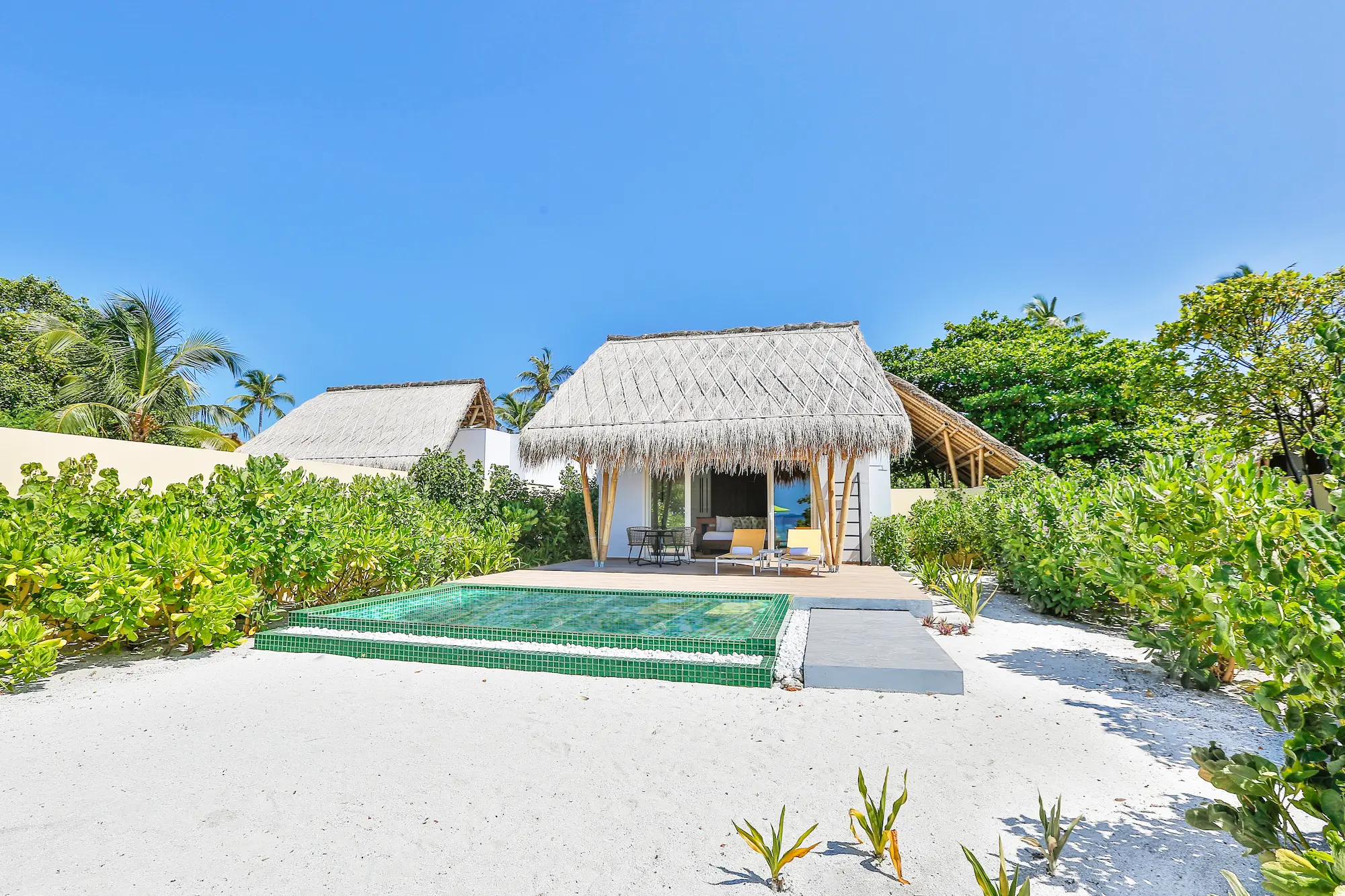 exterior of a beach villa with pool at emerald maldives resort & spa in the maldives featuring a private pool, outdoor terrace and direct beach access