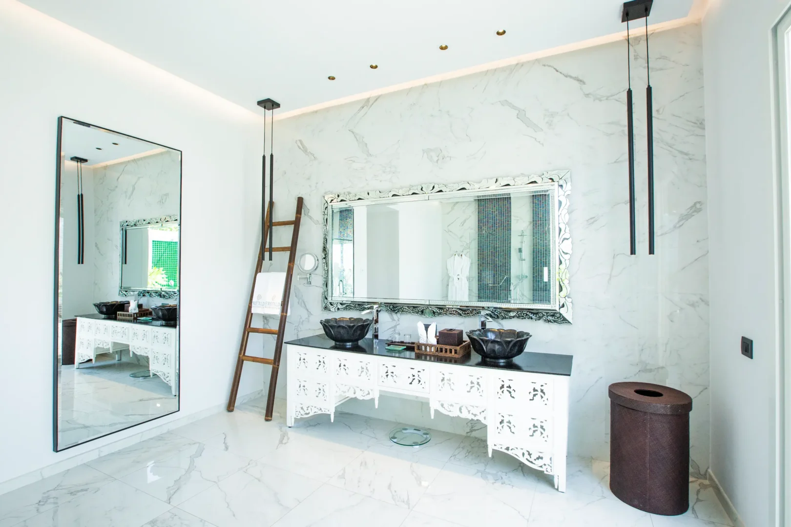 vanity area in a beach villa at emerald maldives resort & spa in the maldives with double washbasins and dressing space