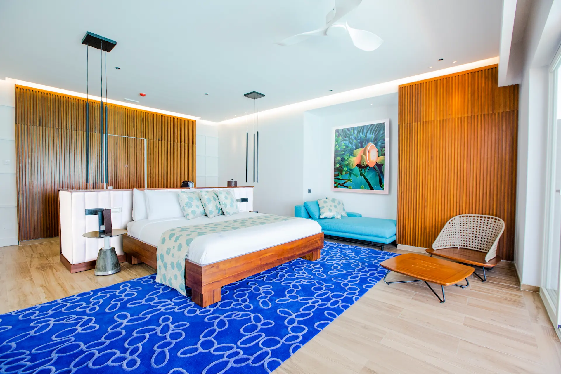 bedroom in a water villa with pool at emerald maldives resort & spa in the maldives featuring contemporary interiors and direct access to a private overwater sundeck and pool