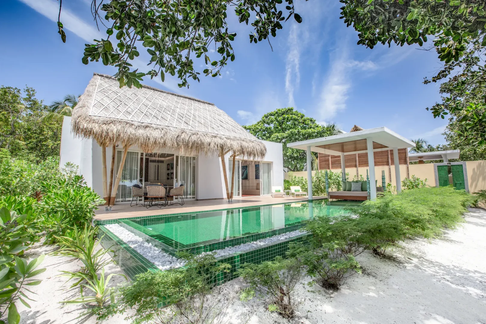 exterior of a superior beach villa with pool at emerald maldives resort & spa in the maldives featuring a private pool, spacious outdoor terrace and direct beach access