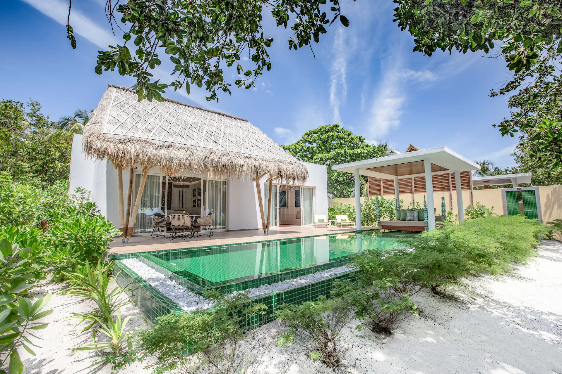 exterior of a superior beach villa with pool at emerald maldives resort & spa in the maldives featuring a private pool, spacious outdoor terrace and direct beach access
