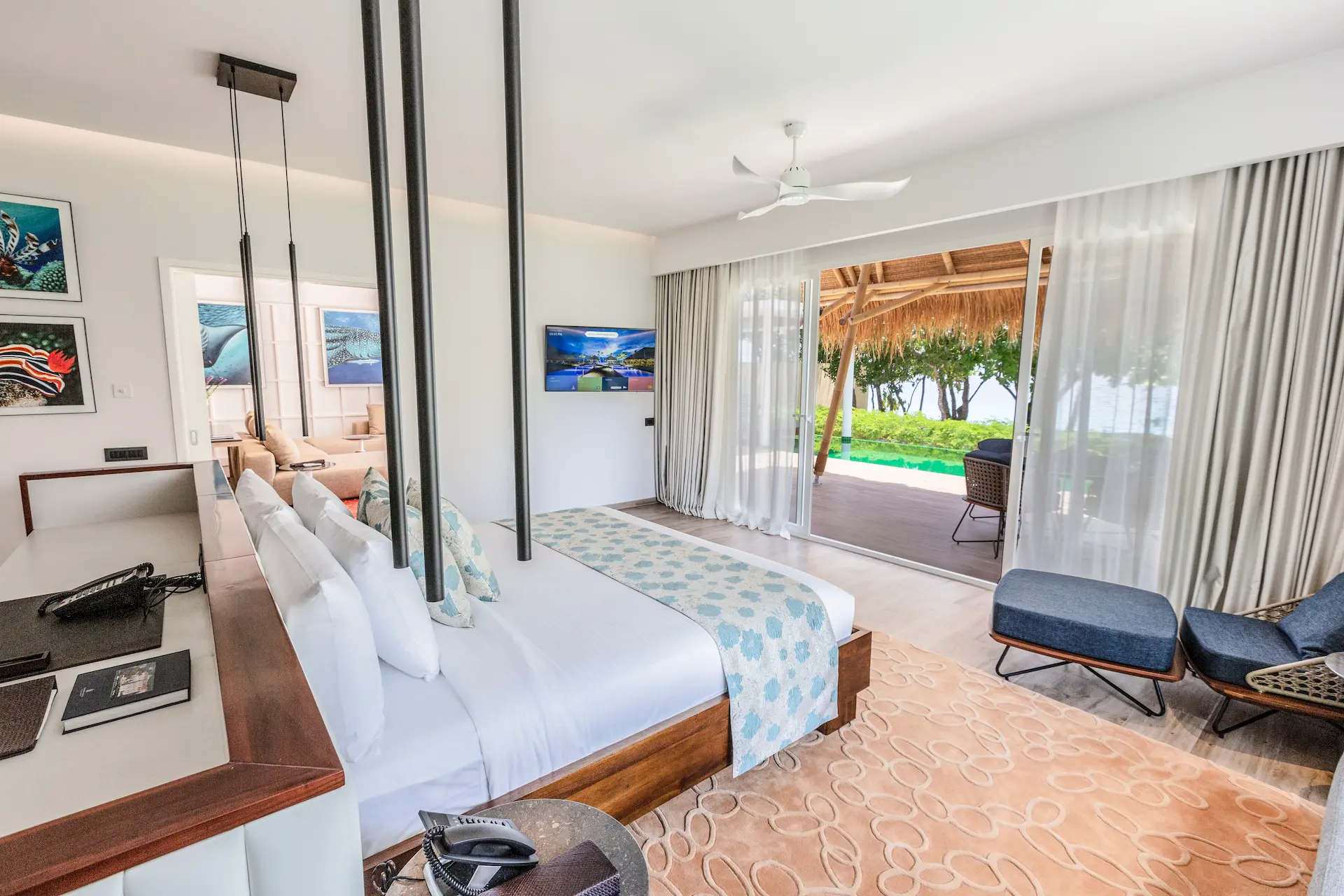 bedroom in a superior beach villa with pool at emerald maldives resort & spa in the maldives featuring contemporary interiors, spacious accommodation and direct access to the outdoor terrace and private pool