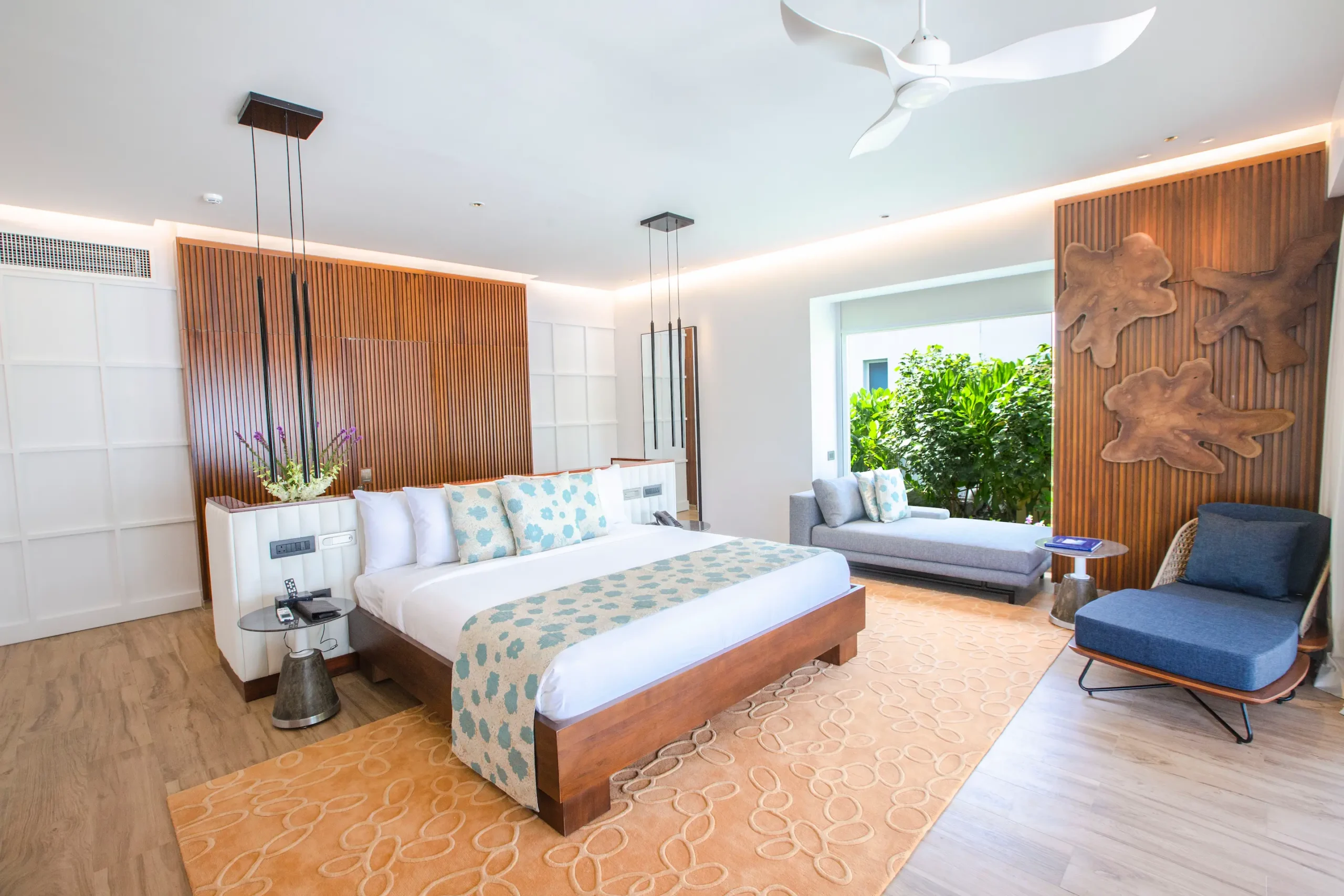 bedroom in a jacuzzi beach villa at emerald maldives resort & spa in the maldives featuring contemporary interiors and direct access to the outdoor terrace