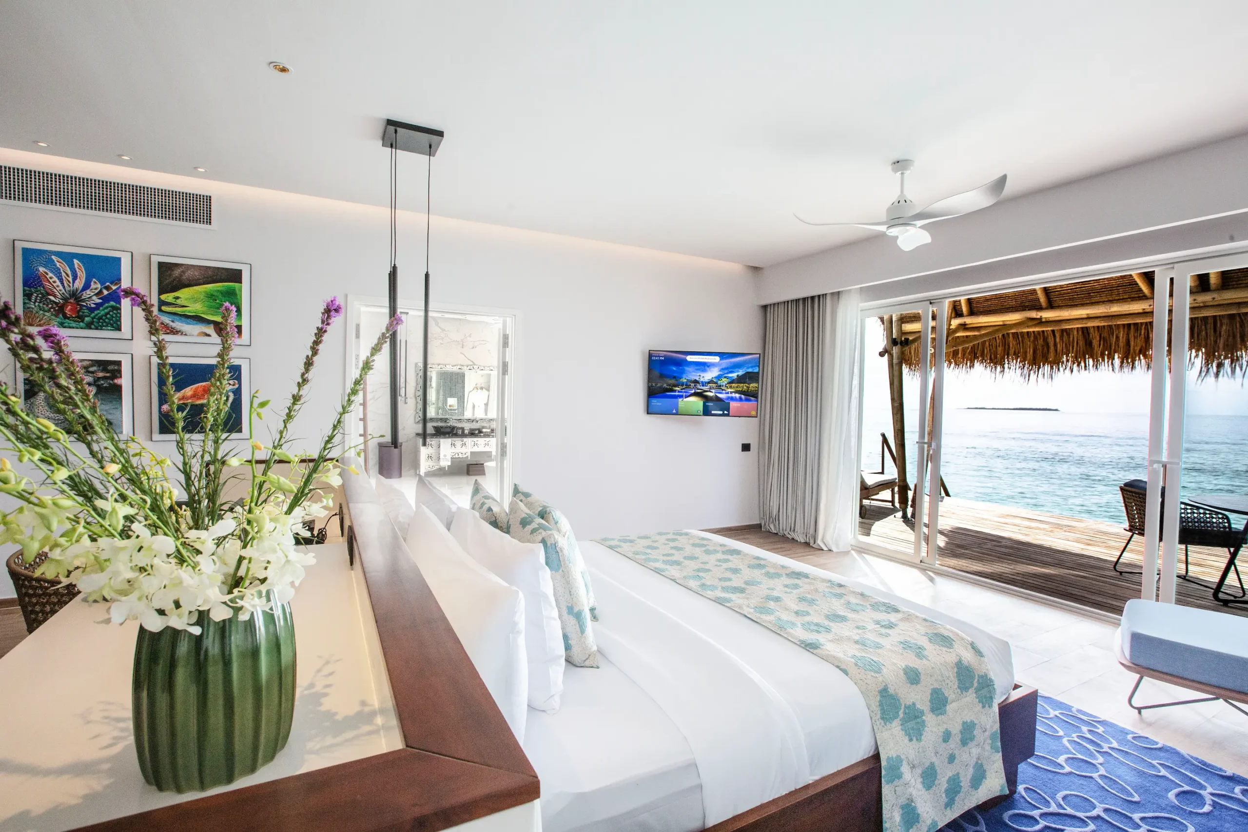bedroom in a jacuzzi water villa at emerald maldives resort & spa in the maldives featuring contemporary interiors and direct access to a private overwater sundeck and outdoor jacuzzi