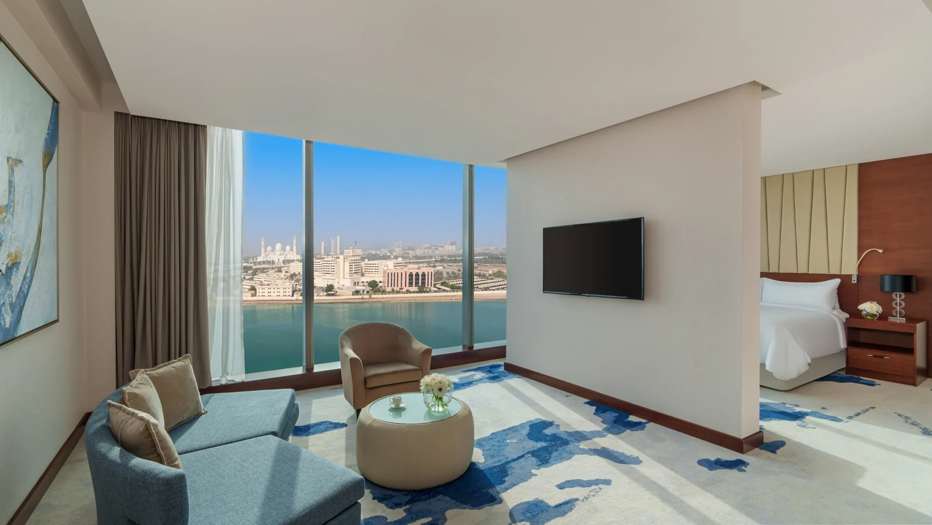 Junior Suite living area at Fairmont Bab Al Bahr Abu Dhabi featuring spacious contemporary accommodation and separate lounge space
