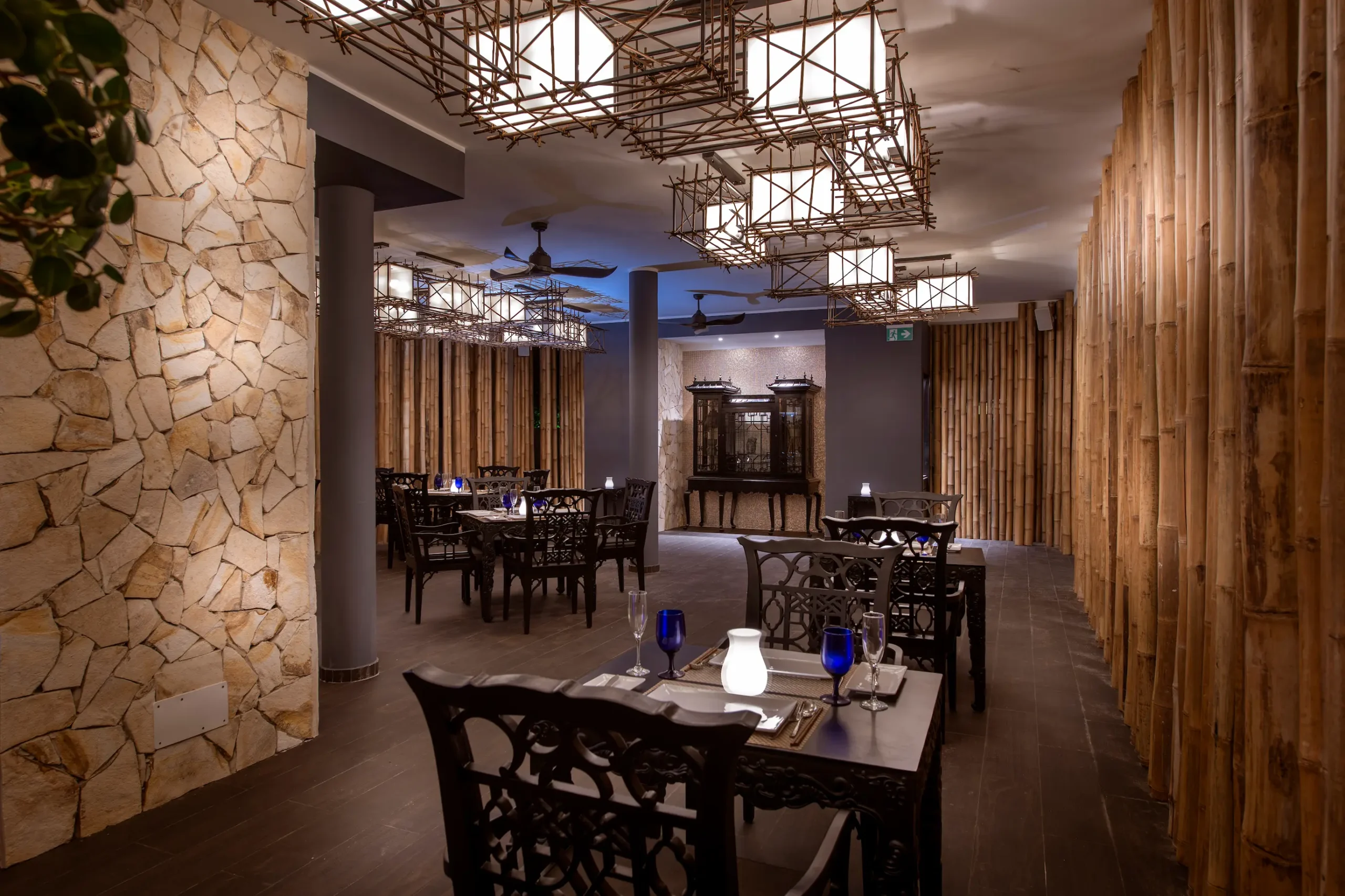 le asiatique restaurant at emerald maldives resort & spa in the maldives serving asian cuisine in a setting surrounded by tropical greenery