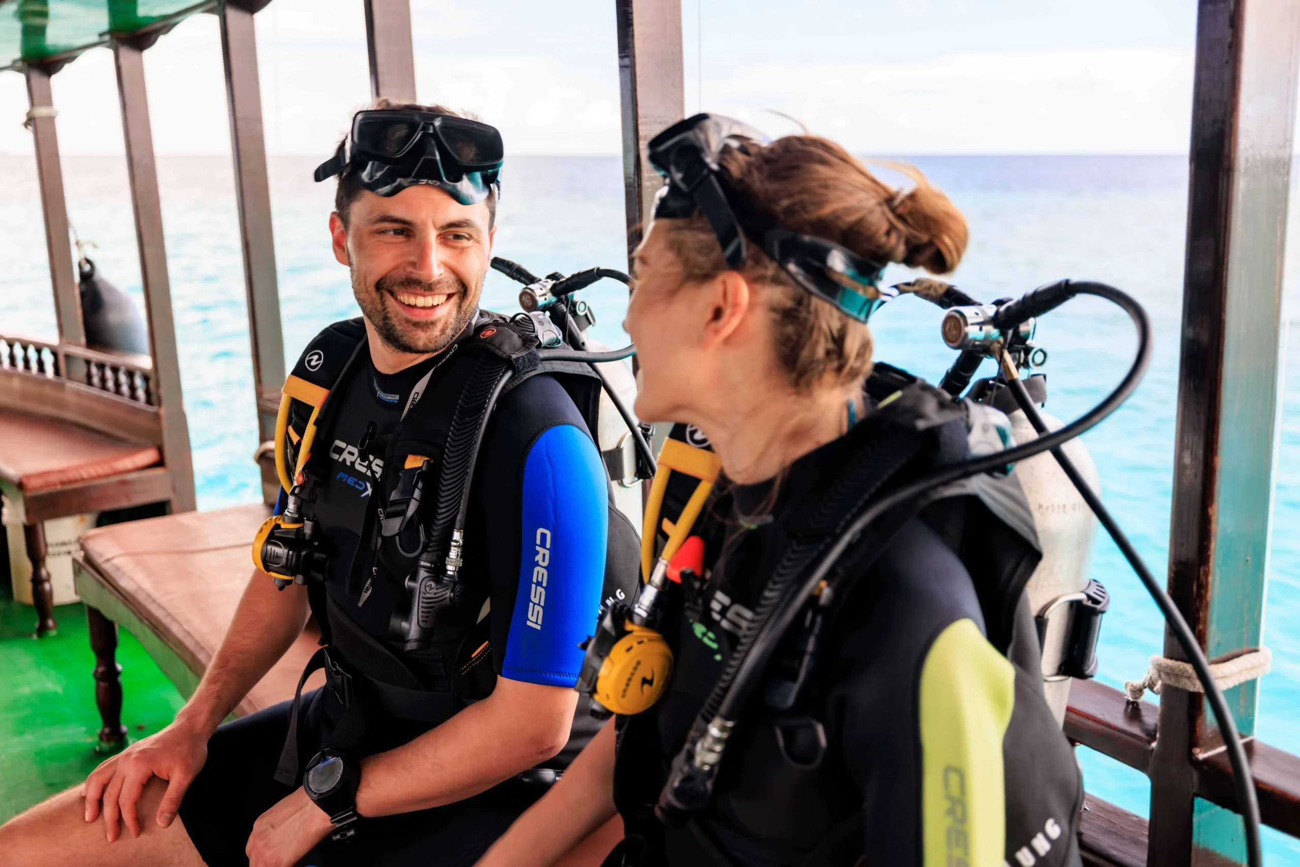 Guests diving in the waters surrounding OZEN LIFE MAADHOO, exploring coral reefs and marine life within South Malé Atoll.