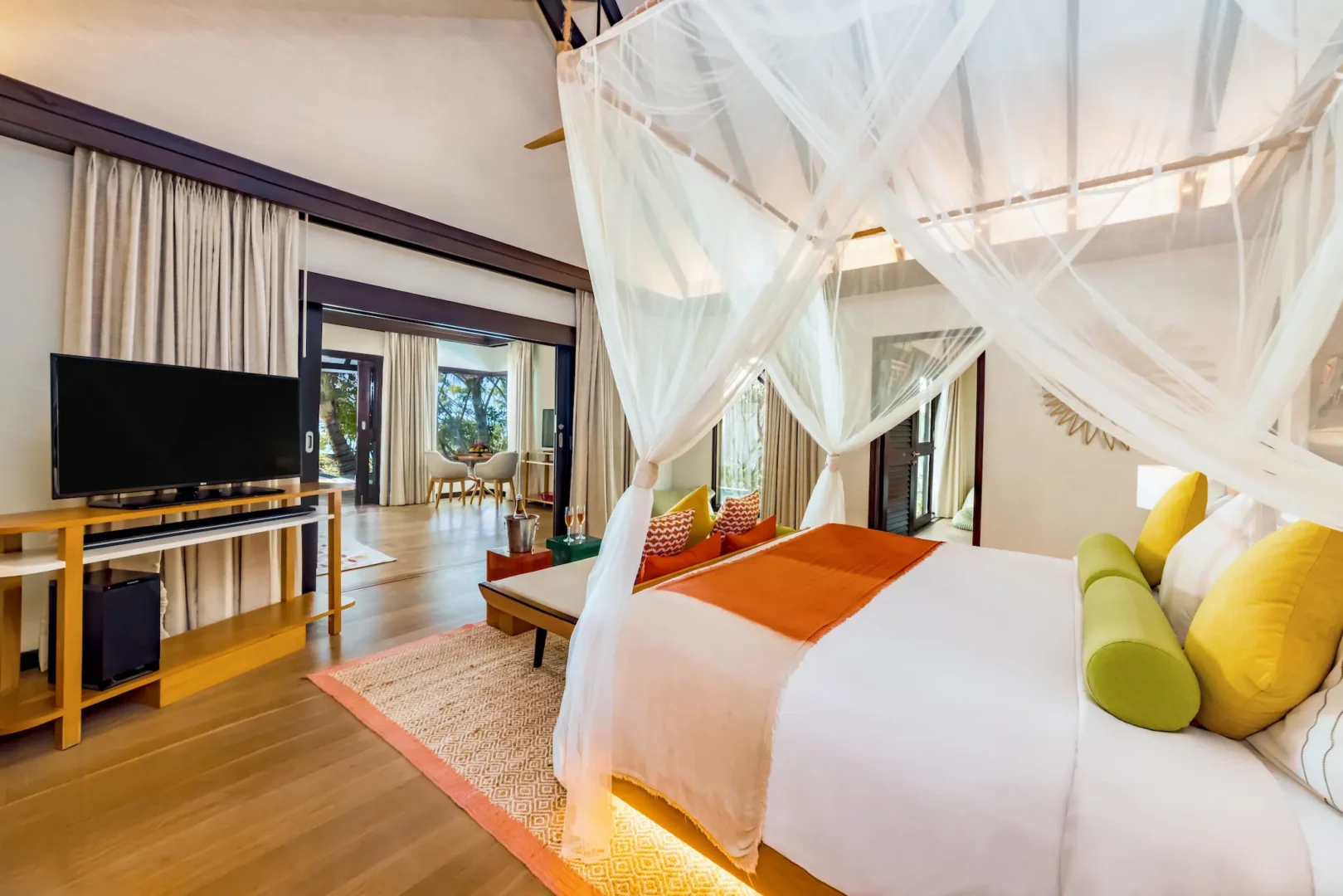 Master bedroom and living area in an Earth Pool Pavilion at OZEN LIFE MAADHOO, featuring spacious contemporary interiors, separate lounge space and accommodation designed for families and groups