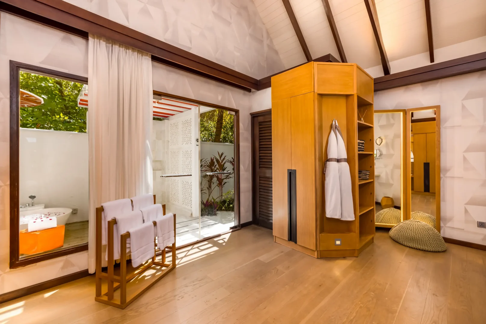 Interior view of the Earth Villa bathroom at OZEN LIFE MAADHOO, featuring a spacious layout, handcrafted bathtub and contemporary design details