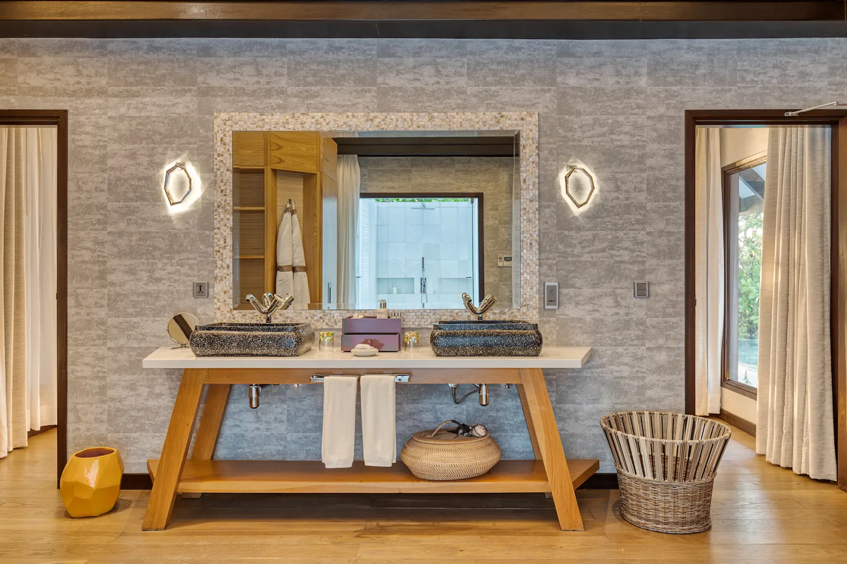 Spacious bathroom in an Earth Villa with Pool at OZEN LIFE MAADHOO featuring a handcrafted bathtub, monsoon shower and indoor-outdoor design surrounded by tropical garden views