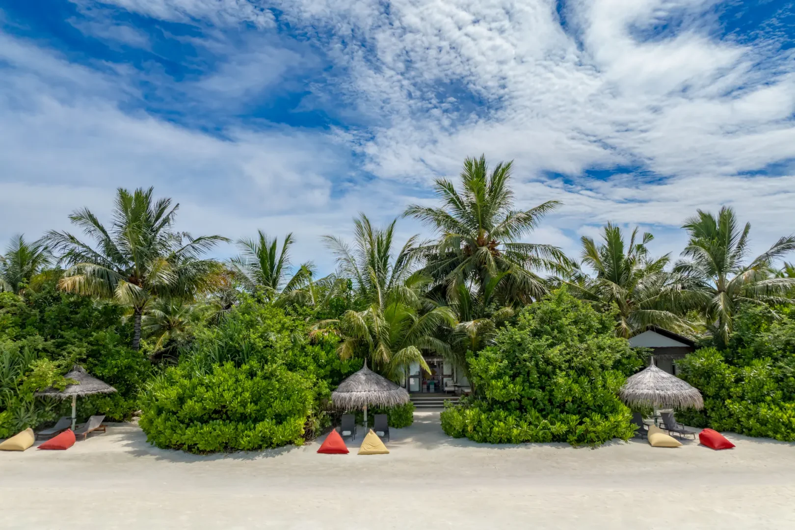 Beach area in front of an Earth Villa with Pool at OZEN LIFE MAADHOO, offering direct beachfront access and views across the lagoon