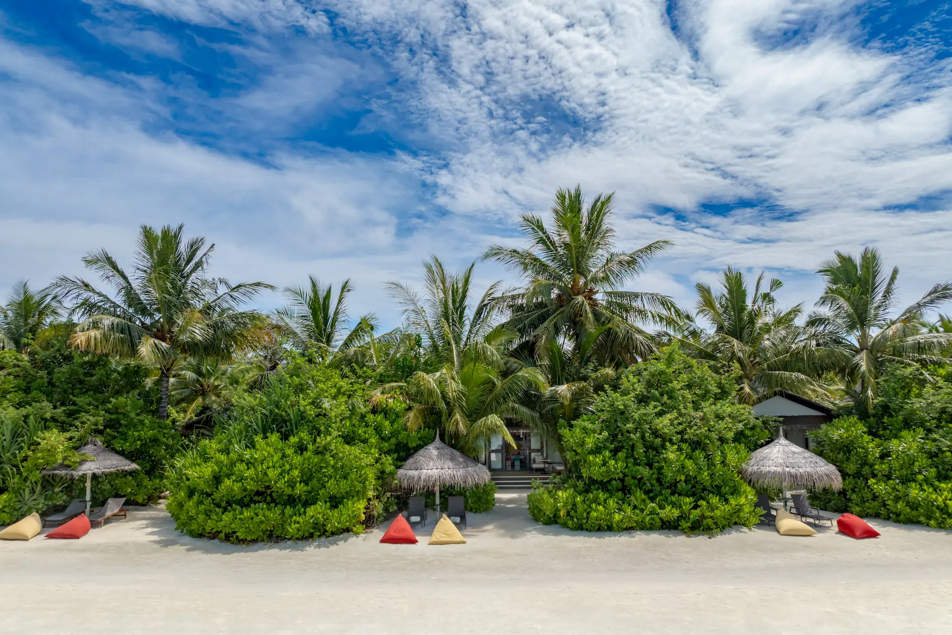 Beach area in front of an Earth Villa with Pool at OZEN LIFE MAADHOO, offering direct beachfront access and views across the lagoon