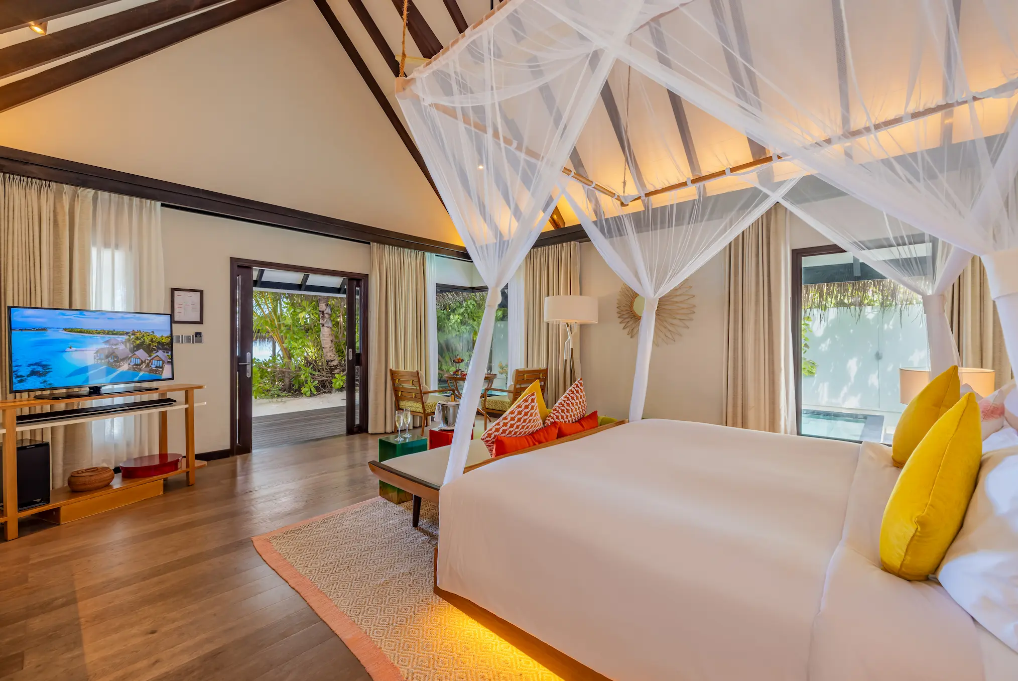 Bedroom view from an Earth Villa with Pool at OZEN LIFE MAADHOO, showcasing contemporary interiors and outlook towards the private outdoor living area and beachfront surroundings