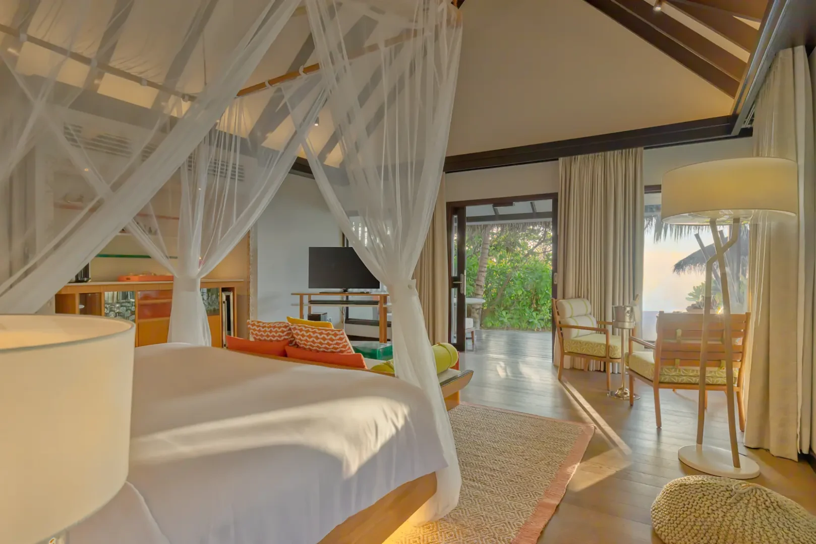Contemporary bedroom interior in an Earth Villa with Pool at OZEN LIFE MAADHOO, featuring spacious living areas, warm natural tones and direct access to outdoor spaces
