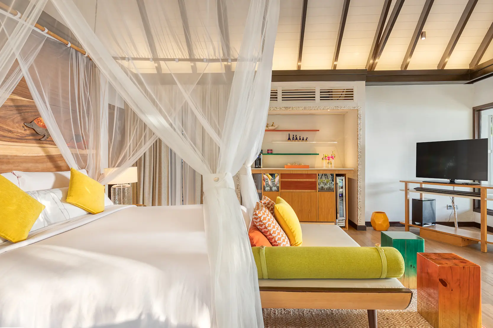 King-size bed in an Earth Villa with Pool at OZEN LIFE MAADHOO, featuring contemporary interiors, warm natural tones and direct access to the outdoor living area