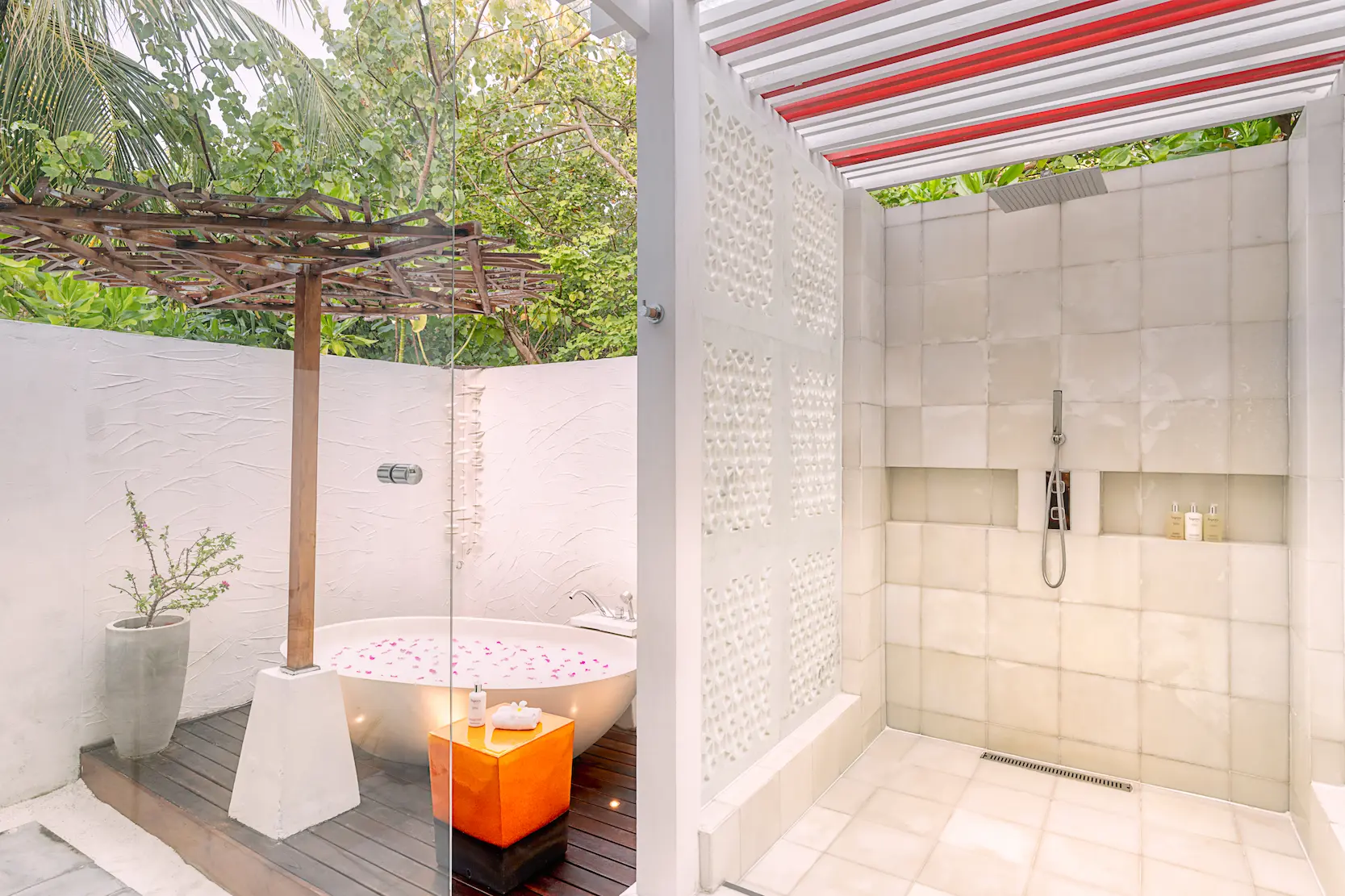 Open-air bathroom in an Earth Villa with Pool at OZEN LIFE MAADHOO featuring a handcrafted bathtub, monsoon shower and private garden setting