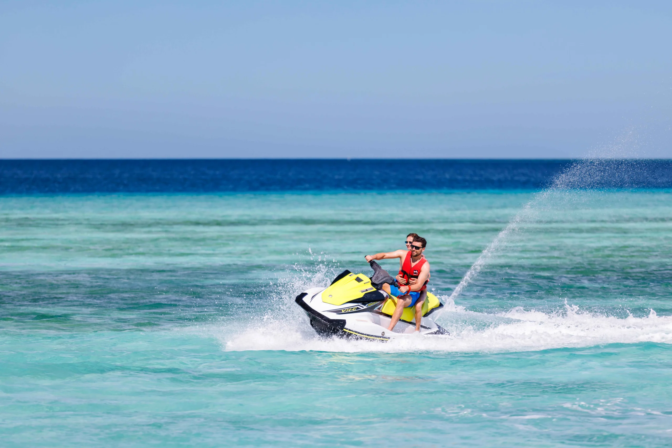 Jet ski experience at OZEN LIFE MAADHOO, with guests exploring the waters of South Malé Atoll on a guided motorised watersports activity.