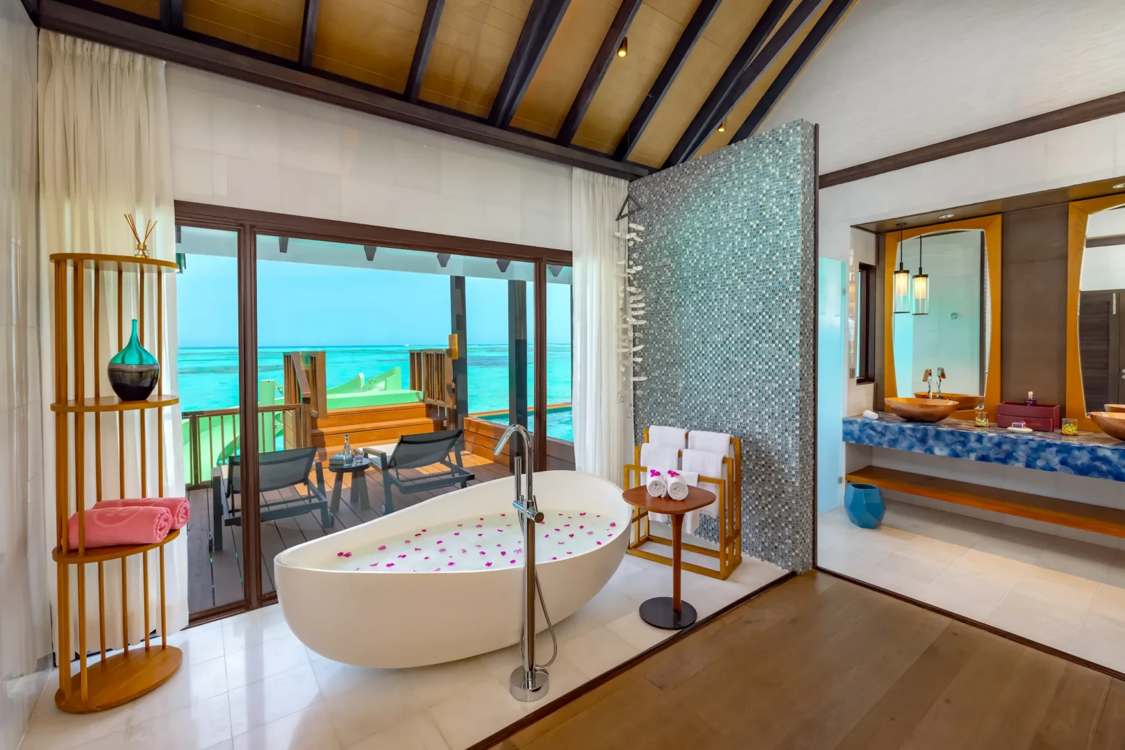 Contemporary bathroom in a Wind Villa with Jacuzzi & Slide at OZEN LIFE MAADHOO featuring a spacious layout, premium finishes and views from the resort's overwater accommodation.
