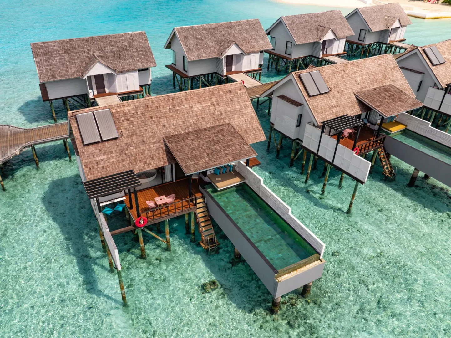 Aerial view of a Wind Villa with Pool at OZEN LIFE MAADHOO, highlighting the overwater location, private infinity pool and position above the lagoon