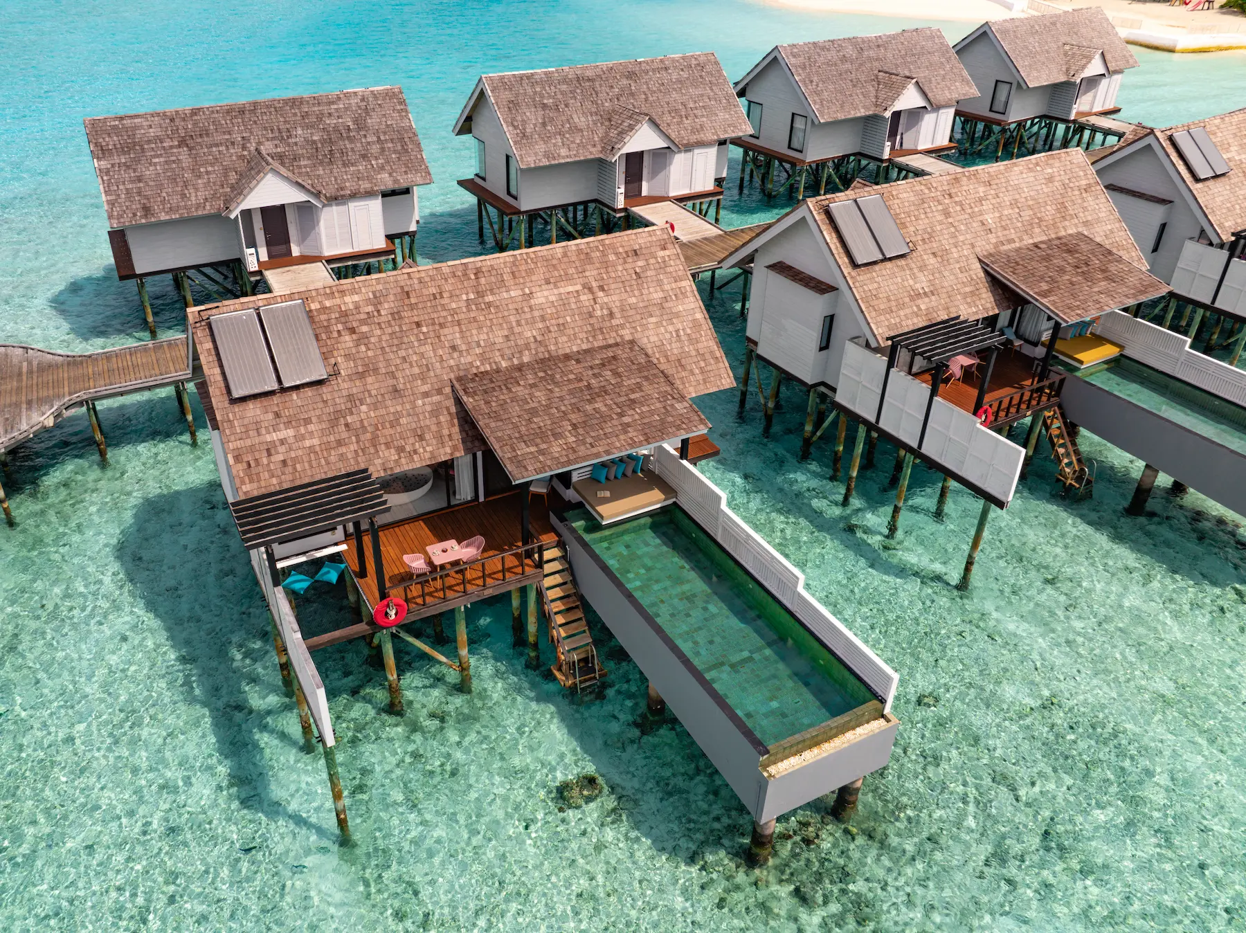Aerial view of a Wind Villa with Pool at OZEN LIFE MAADHOO, highlighting the overwater location, private infinity pool and position above the lagoon